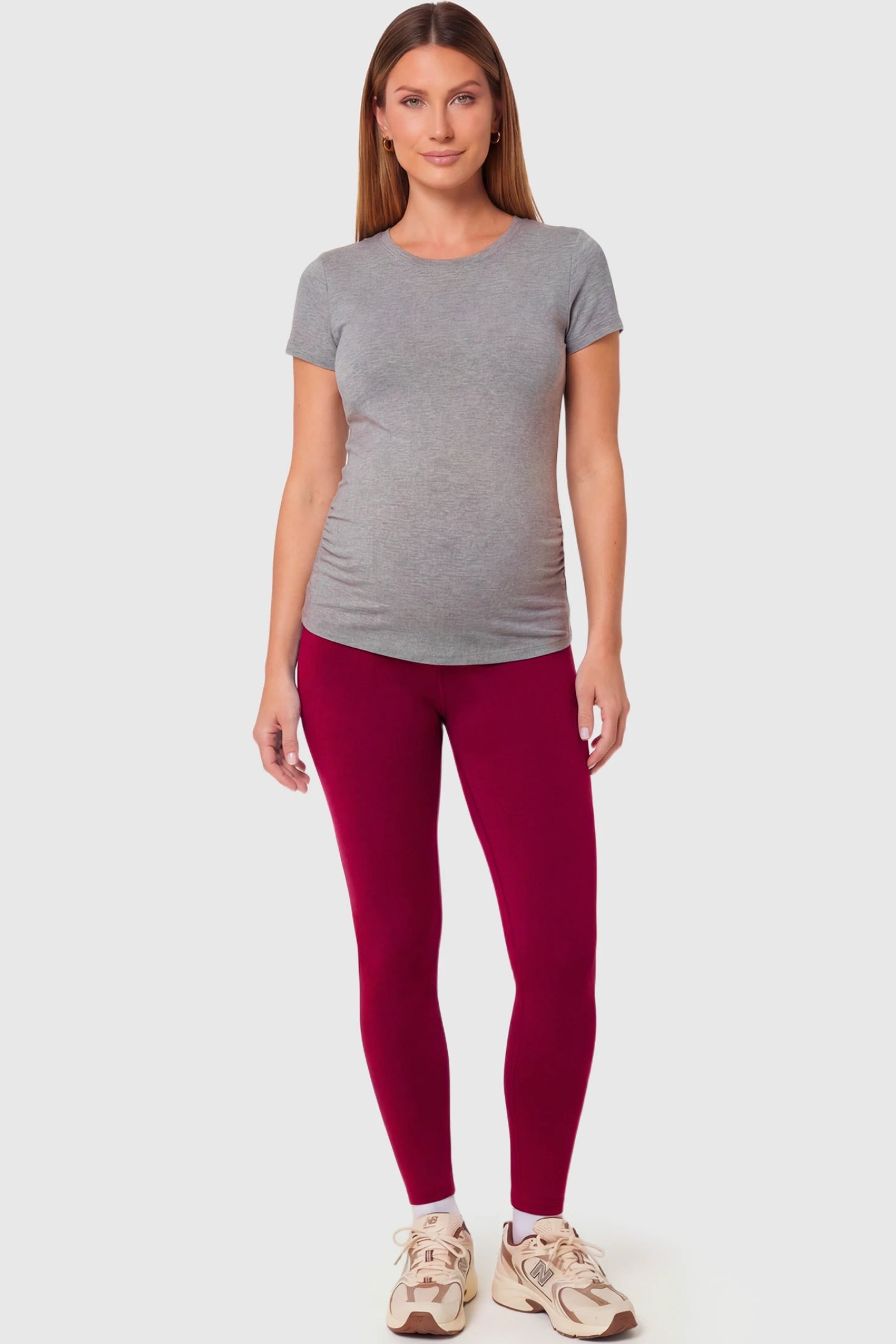 Full-Panel Ankle-Length Maternity Yoga Leggings Full-Panel Ankle-Length Maternity Yoga Leggings in brick red featuring over-the-belly support and full-length fit on pregnant model.