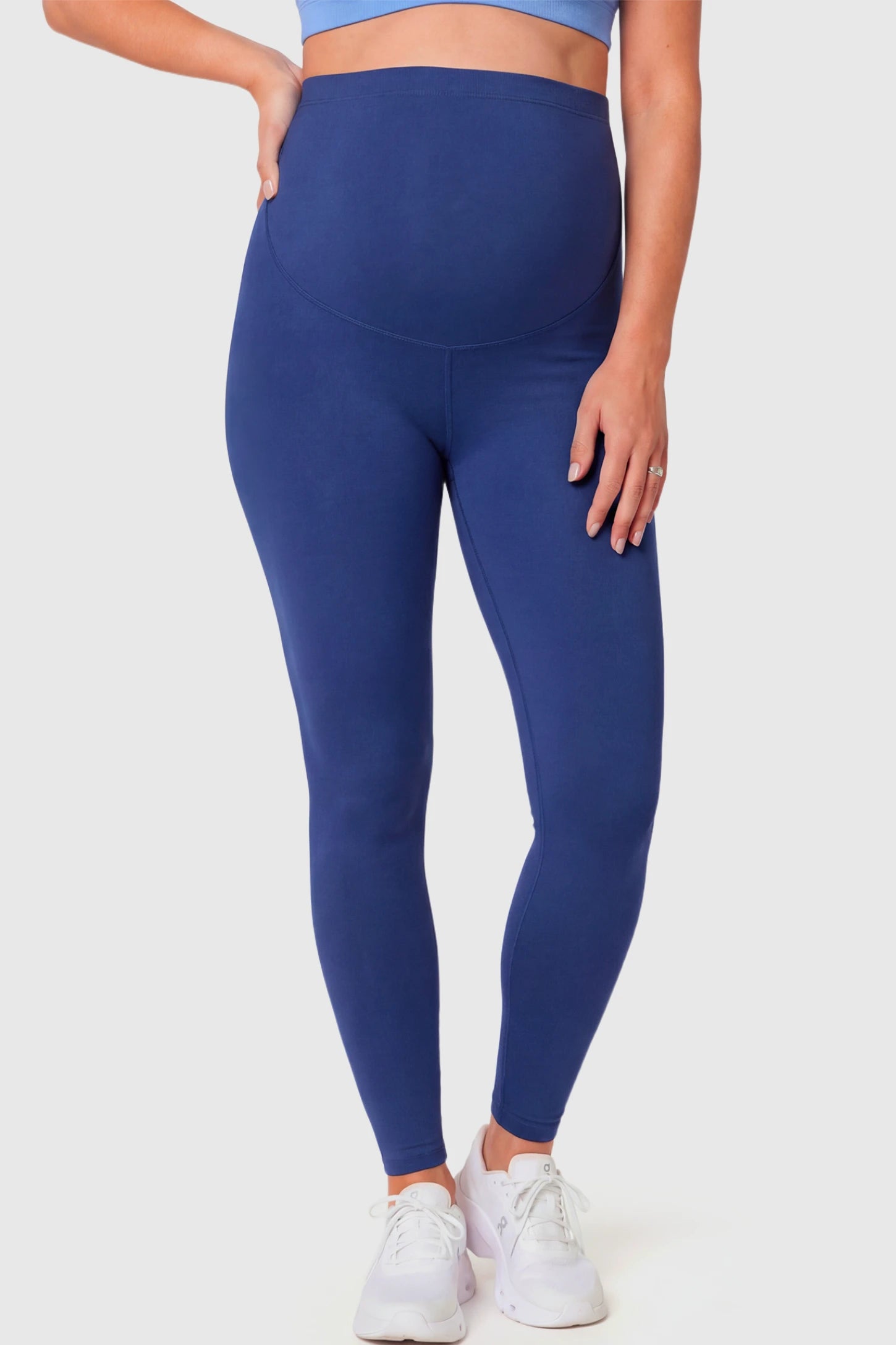 Full-Panel Ankle-Length Maternity Yoga Leggings Full-Panel Ankle-Length Maternity Yoga Leggings in navy blue featuring over-the-belly support and full-length fit on pregnant model.