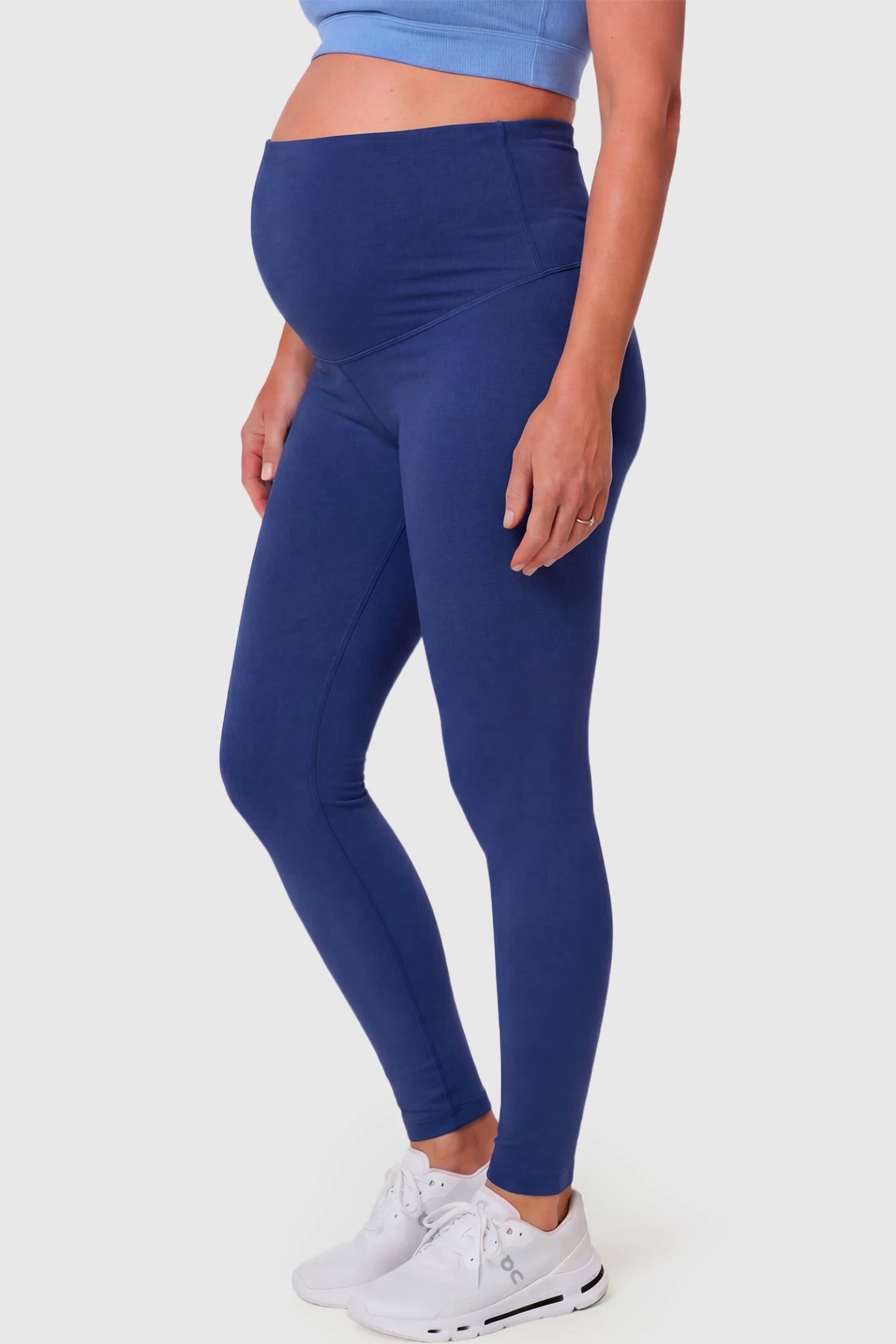Full-Panel Ankle-Length Maternity Yoga Leggings Full-Panel Ankle-Length Maternity Yoga Leggings in navy blue featuring over-the-belly support and full-length fit on pregnant model.