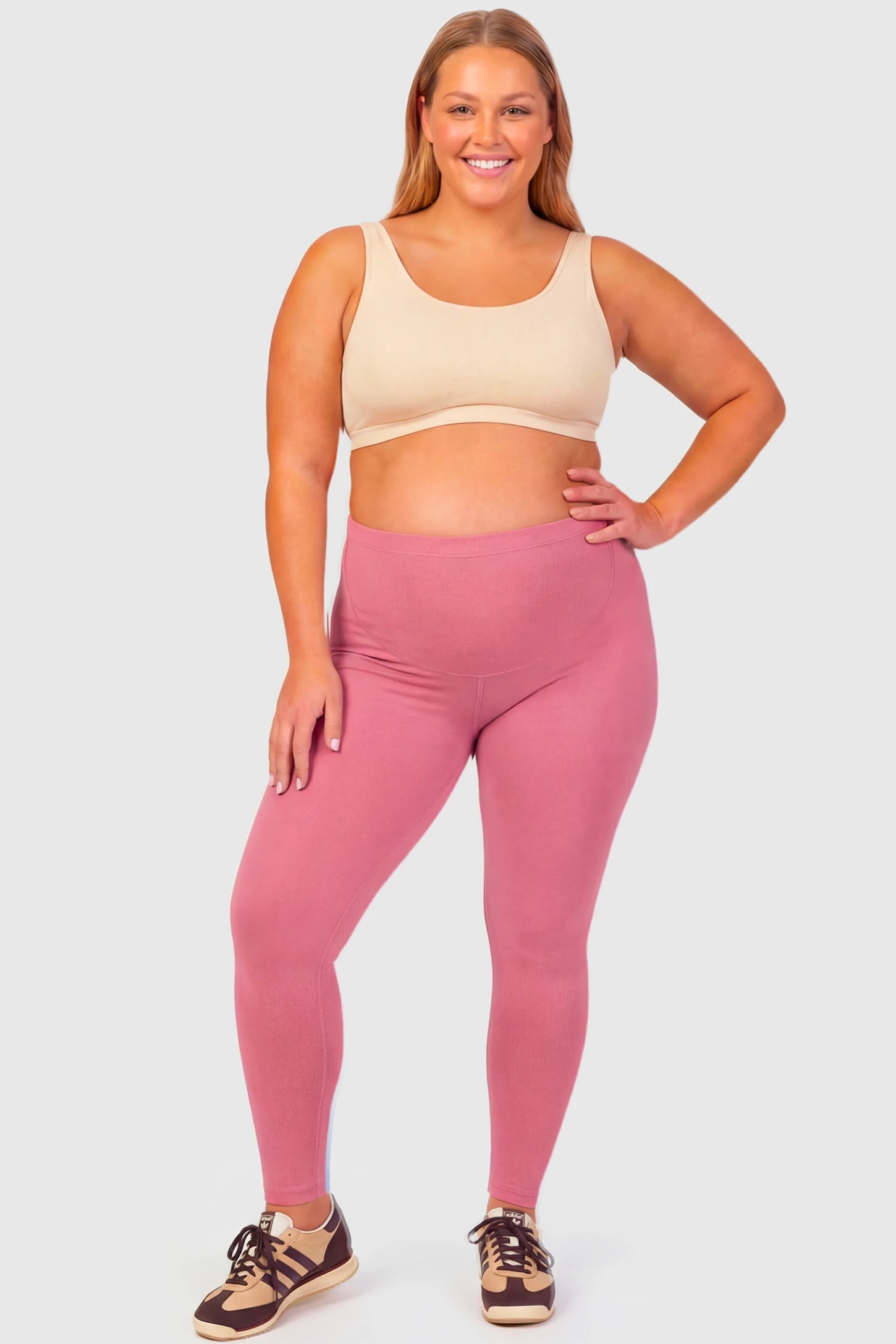 Full-Panel Ankle-Length Maternity Yoga Leggings Full-Panel Ankle-Length Maternity Yoga Leggings in rouge pink featuring over-the-belly support and full-length fit on plus size pregnant model.