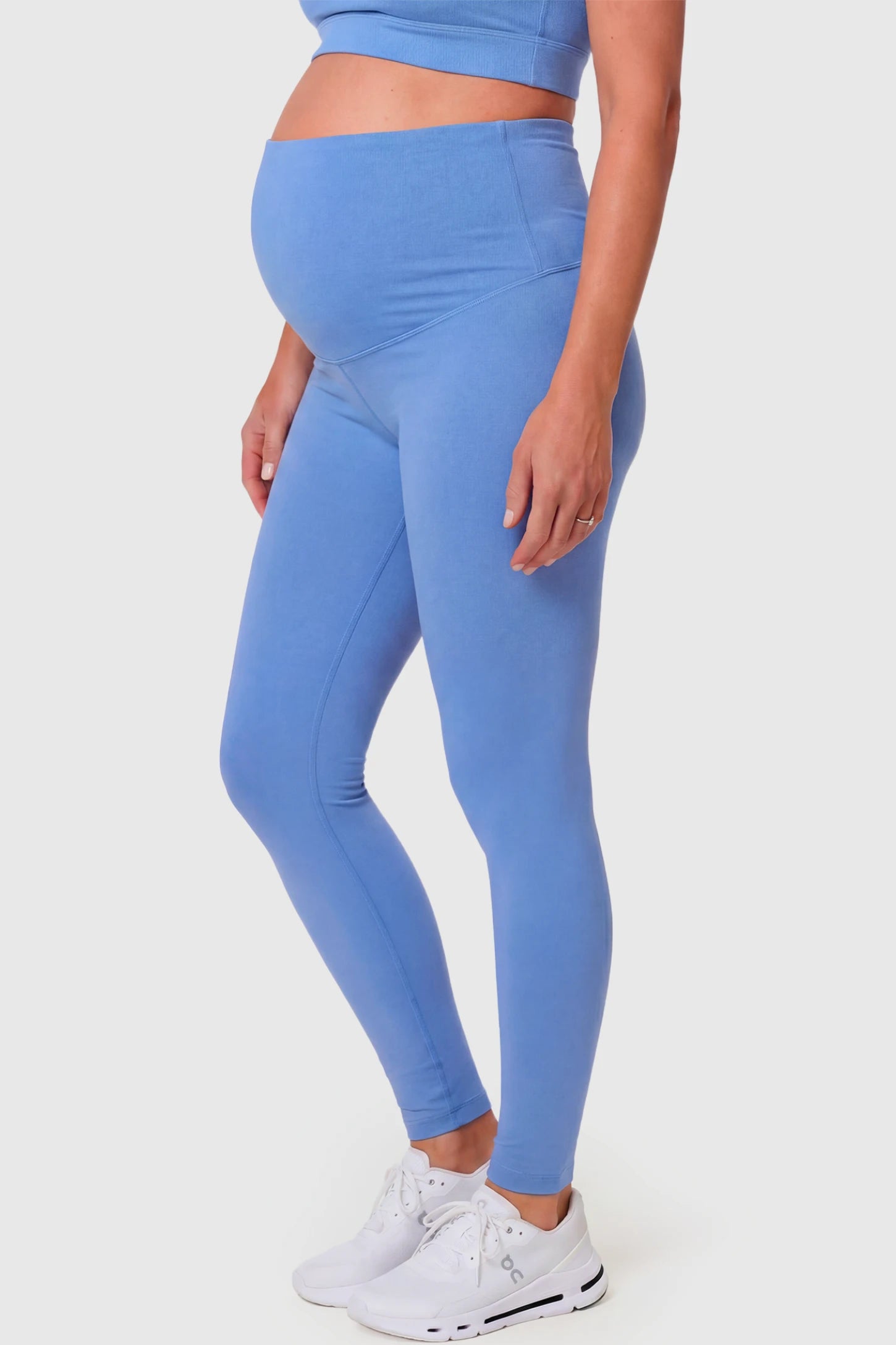 Full-Panel Ankle-Length Maternity Yoga Leggings Full-Panel Ankle-Length Maternity Yoga Leggings in sky blue featuring over-the-belly support and full-length fit on pregnant model.