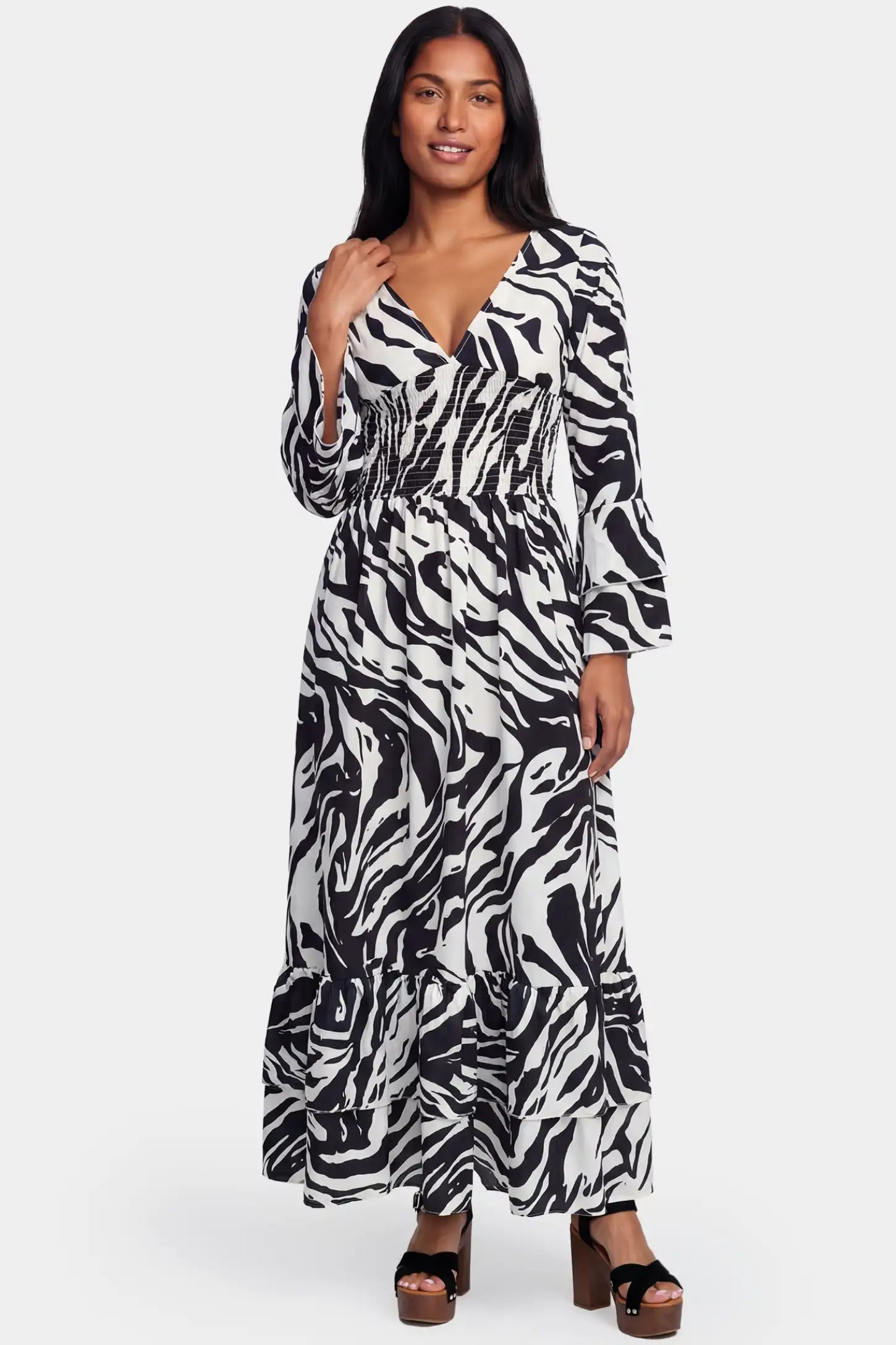 Geometric Stripe Print V-Neck Long Sleeve Tiered Maxi Maternity Dress Geometric stripe print V-neck long sleeve tiered maxi maternity dress in black featuring bold stripe pattern in front view on a postpartum model