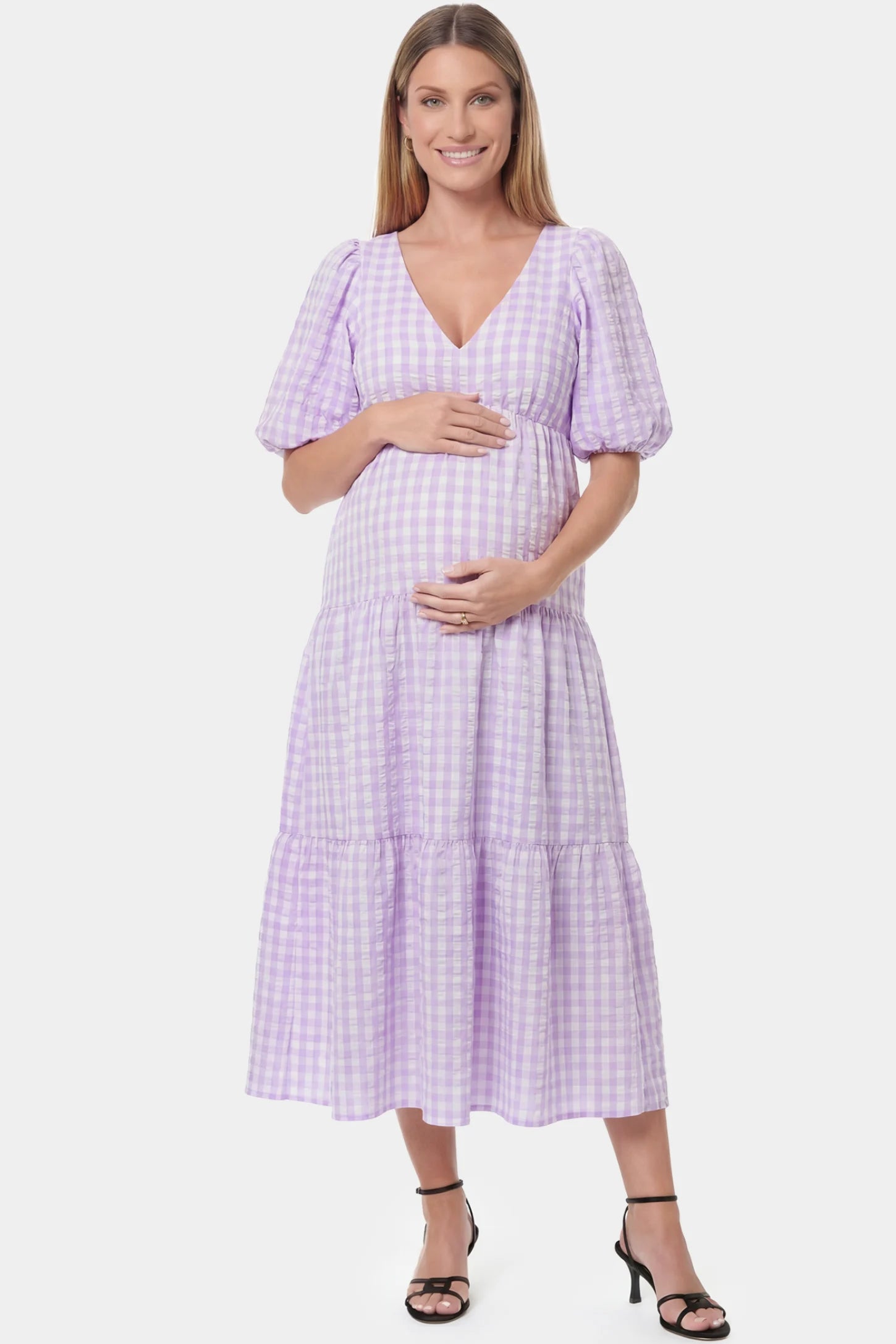 Gingham V-Neck Tiered Maxi Maternity Dress in Lavender featuring a flowing tiered silhouette in full body front view on a pregnant model