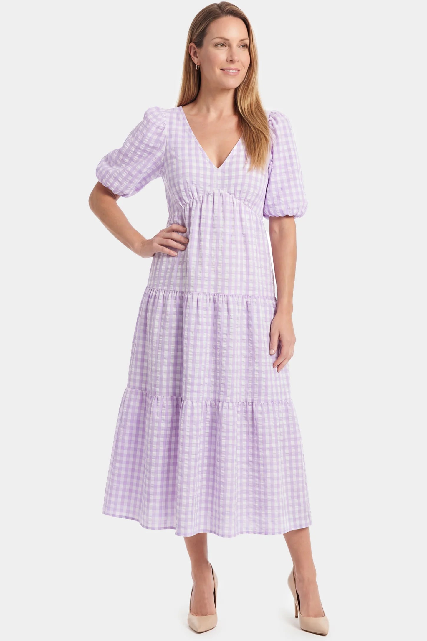 Gingham V-Neck Tiered Maxi Maternity Dress Gingham V-Neck Tiered Maxi Maternity Dress in lavender featuring a flowing tiered silhouette in full body front view on a postpartum model
