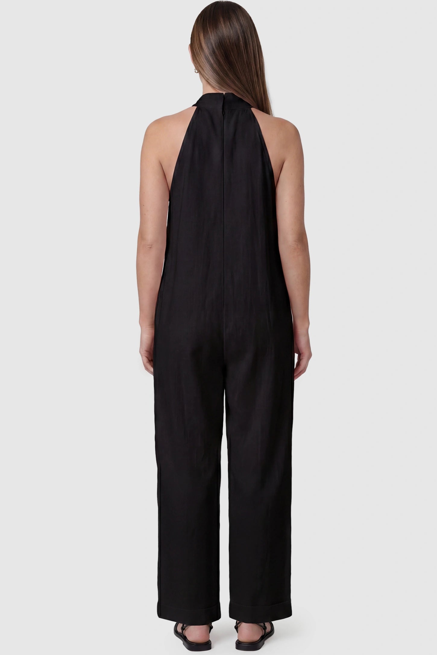 Halter Neck Wide-Leg Maternity Jumpsuit Halter neck wide-leg maternity jumpsuit in black with breathable cotton fabric, back view on pregnant model