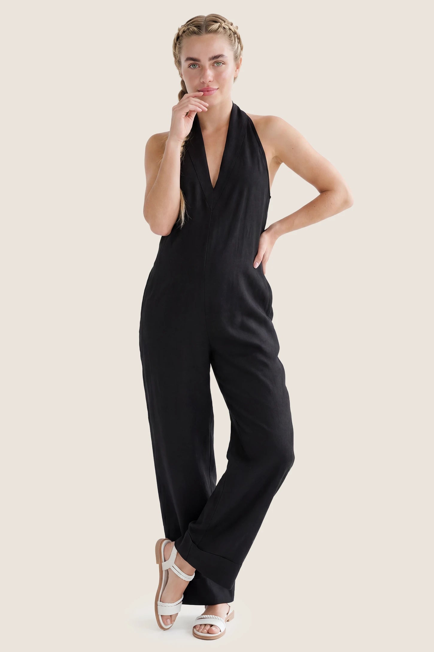Halter Neck Wide-Leg Maternity Jumpsuit Halter neck wide-leg maternity jumpsuit in black with chic halter neckline, front view on plus-size model
