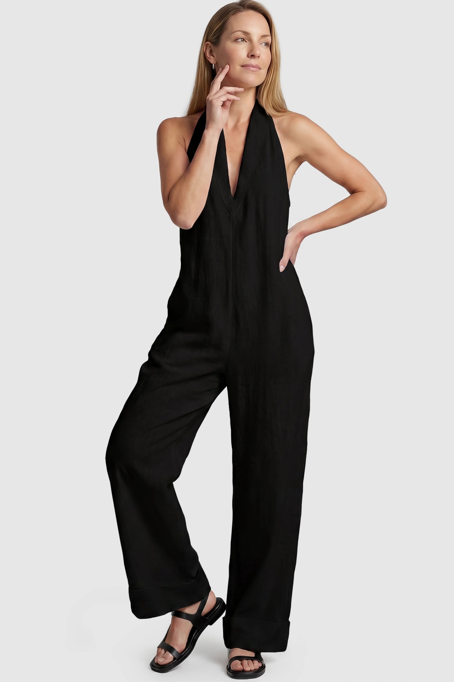 Halter Neck Wide-Leg Maternity Jumpsuit Halter neck wide-leg maternity jumpsuit in black with chic halter neckline, front view on postpartum model