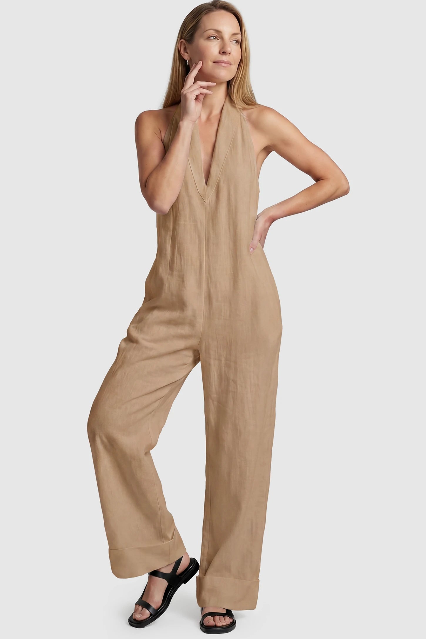 Halter Neck Wide-Leg Maternity Jumpsuit Halter neck wide-leg maternity jumpsuit in camel with chic halter neckline, front view on postpartum model