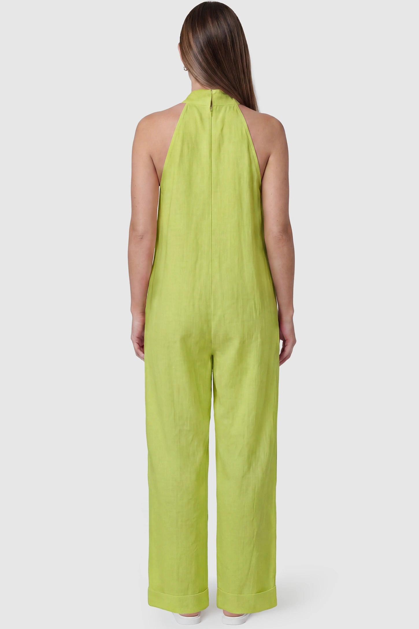 Halter Neck Wide-Leg Maternity Jumpsuit Halter neck wide-leg maternity jumpsuit in green with breathable cotton fabric, back view on pregnant model