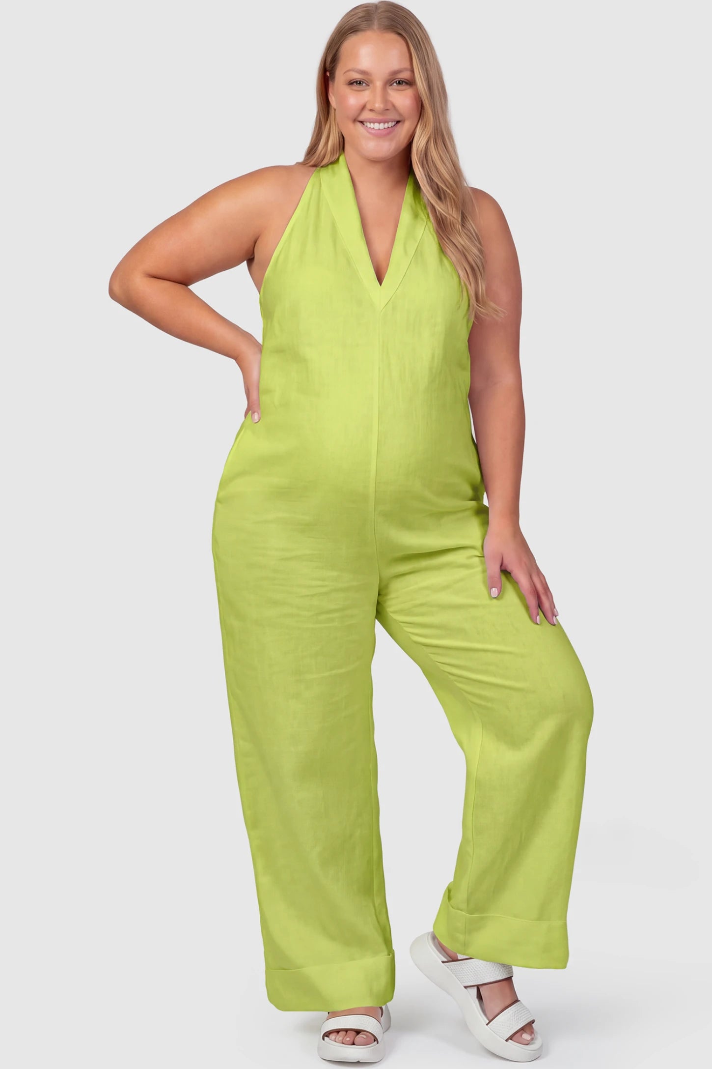 Halter Neck Wide-Leg Maternity Jumpsuit Halter neck wide-leg maternity jumpsuit in green with chic halter neckline, front view on plus-size model