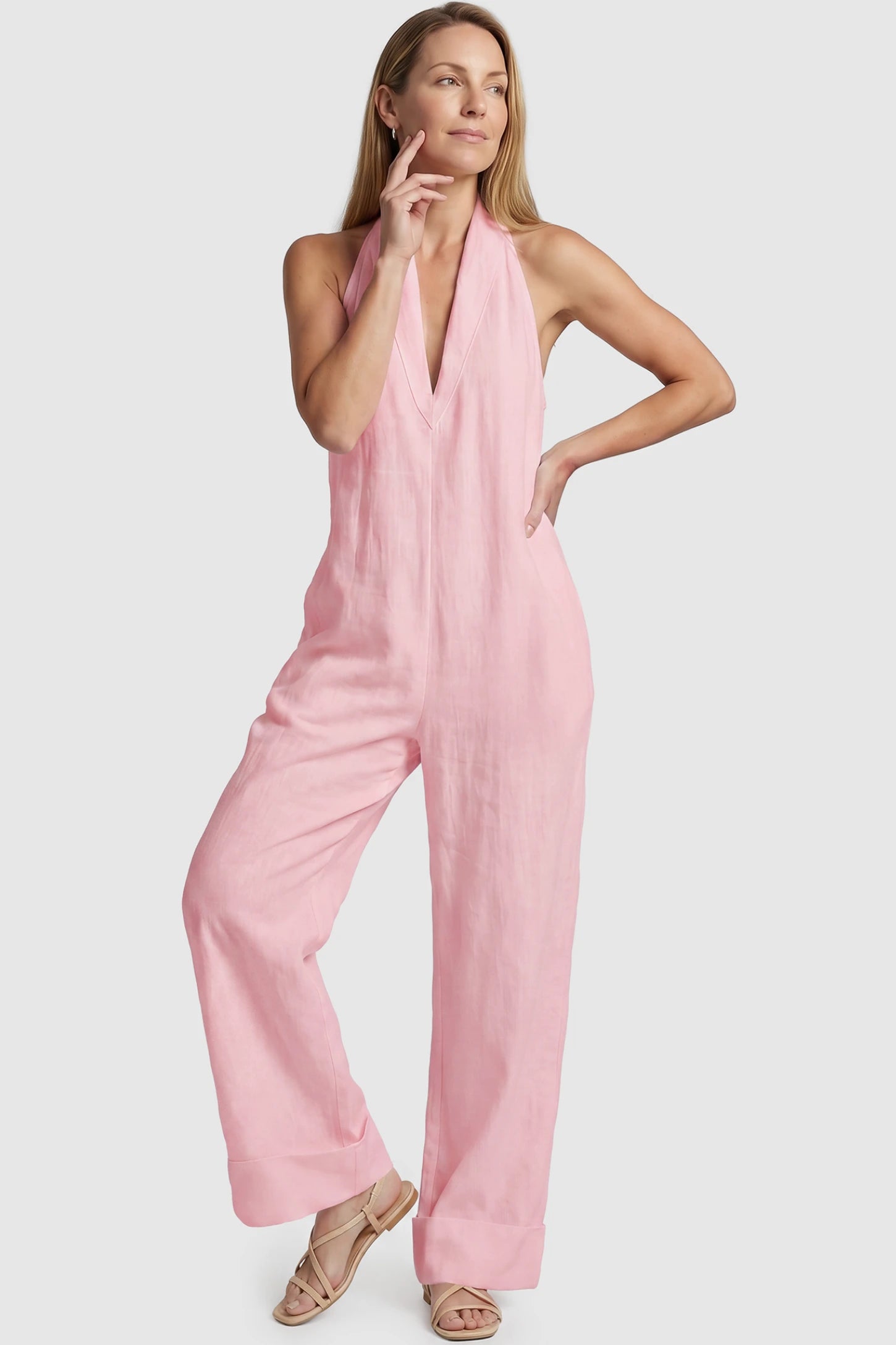 Halter Neck Wide-Leg Maternity Jumpsuit Halter neck wide-leg maternity jumpsuit in pink with chic halter neckline, front view on postpartum model