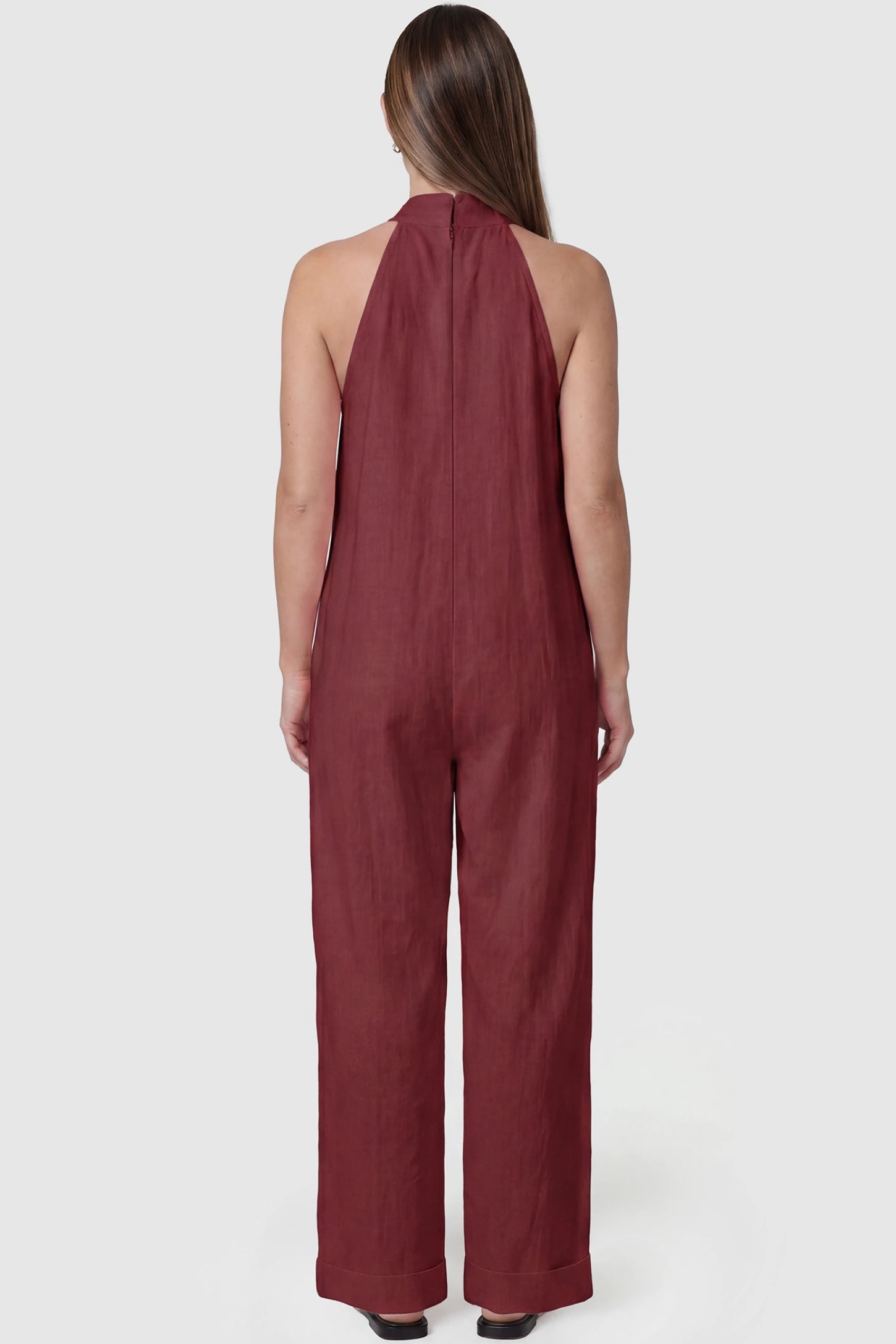 Halter Neck Wide-Leg Maternity Jumpsuit Halter neck wide-leg maternity jumpsuit in wine red with breathable cotton fabric, back view on pregnant model
