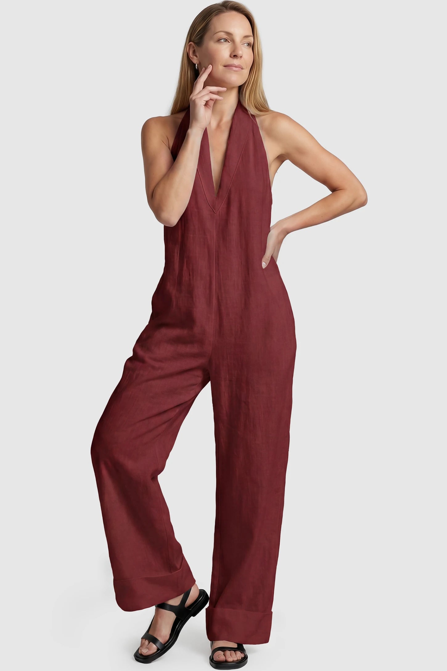 Halter Neck Wide-Leg Maternity Jumpsuit Halter neck wide-leg maternity jumpsuit in wine red with chic halter neckline, front view on postpartum model