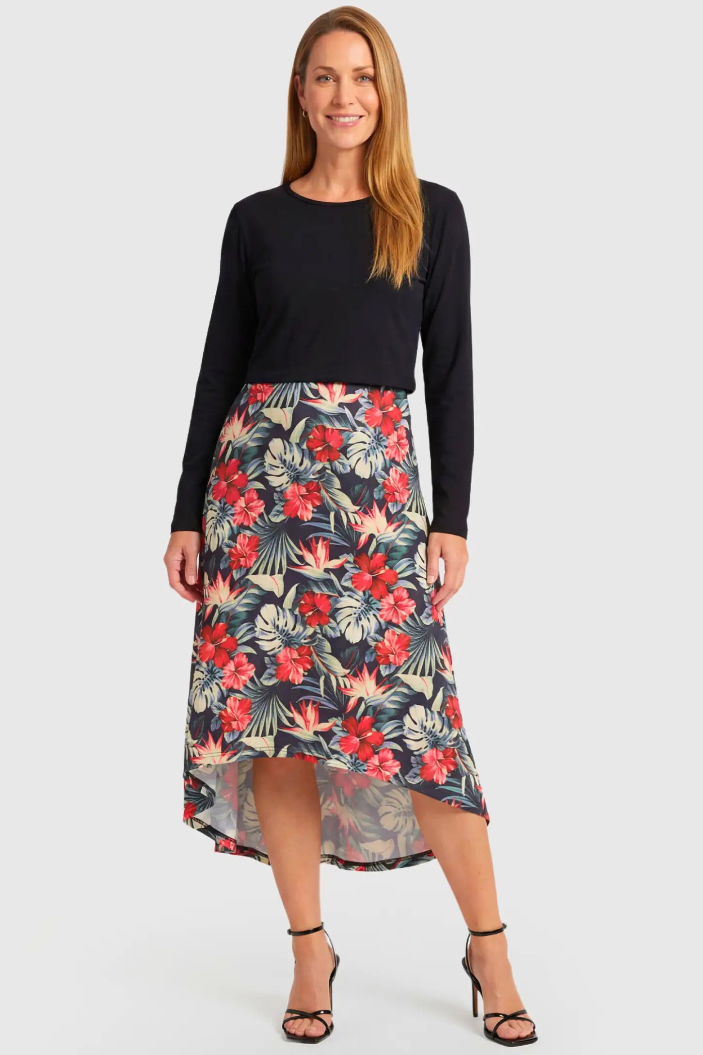 Hi-Low Long Sleeve Maternity & Nursing Midi Dress Hi-Low Long Sleeve Maternity & Nursing Midi Dress in black and floral featuring empire waist and long sleeves on a non pregnant model.