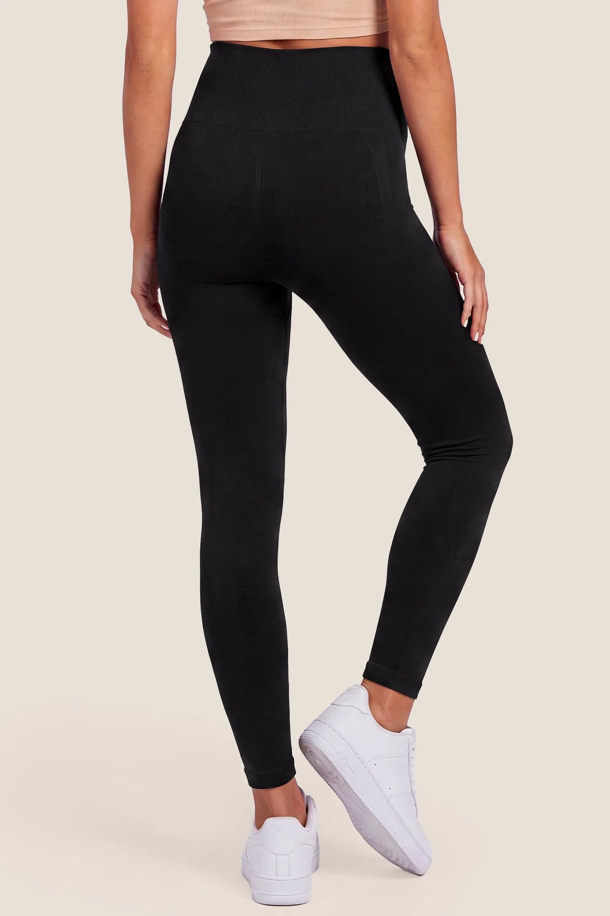 High Waist Full Length Maternity Leggings High Waist Full Length Maternity Leggings in Black featuring four-way stretch fabric, full length coverage, seamless knit waistband, and contoured fit on a pregnant model, back view.