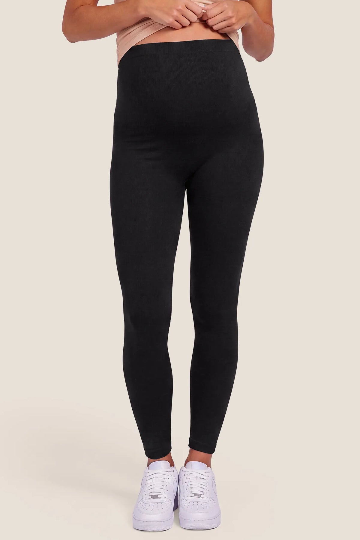 High Waist Full Length Maternity Leggings High Waist Full Length Maternity Leggings in Black featuring seamless knit waistband, high-waisted over-belly panel, and full length activewear fit on a pregnant model, front view.