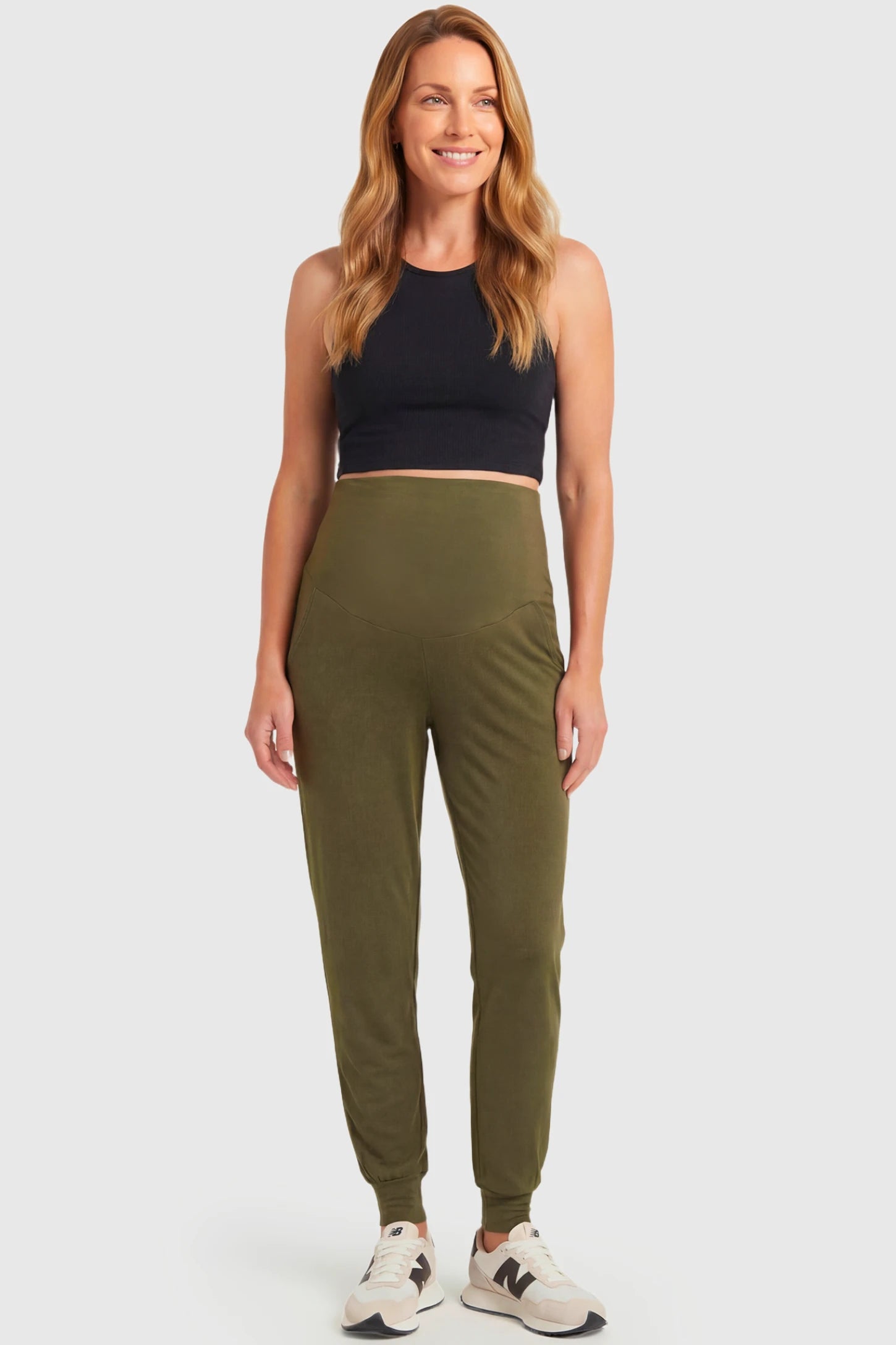 Full-Panel Cuffed Maternity Joggers Full-Panel Cuffed Maternity Joggers in army green featuring high-rise over-the-belly panel, ribbed cuff hem, and side pockets on non pregnant model.