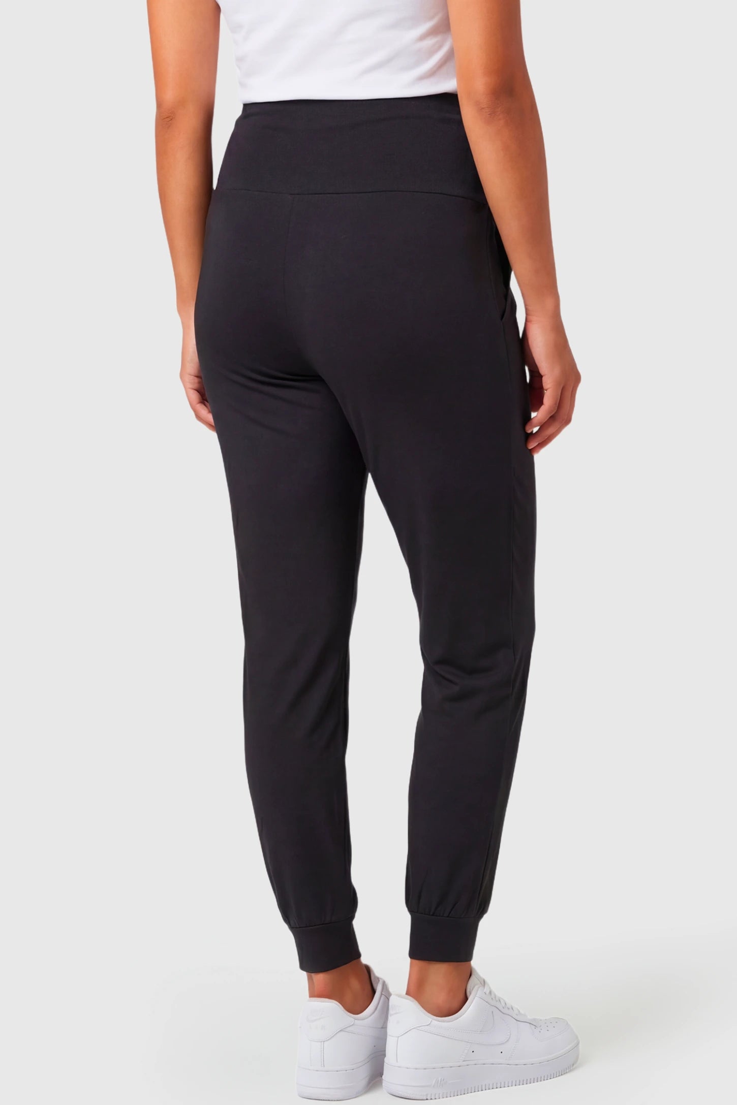 Full-Panel Cuffed Maternity Joggers Full-Panel Cuffed Maternity Joggers in black featuring high-rise over-the-belly panel, and ribbed cuff hem on pregnant model.