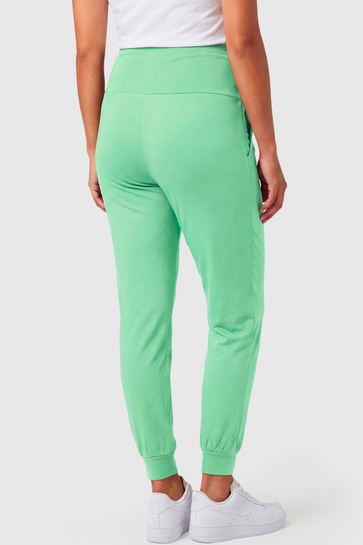 Full-Panel Cuffed Maternity Joggers Full-Panel Cuffed Maternity Joggers in light green featuring high-rise over-the-belly panel, and ribbed cuff hem on pregnant model.