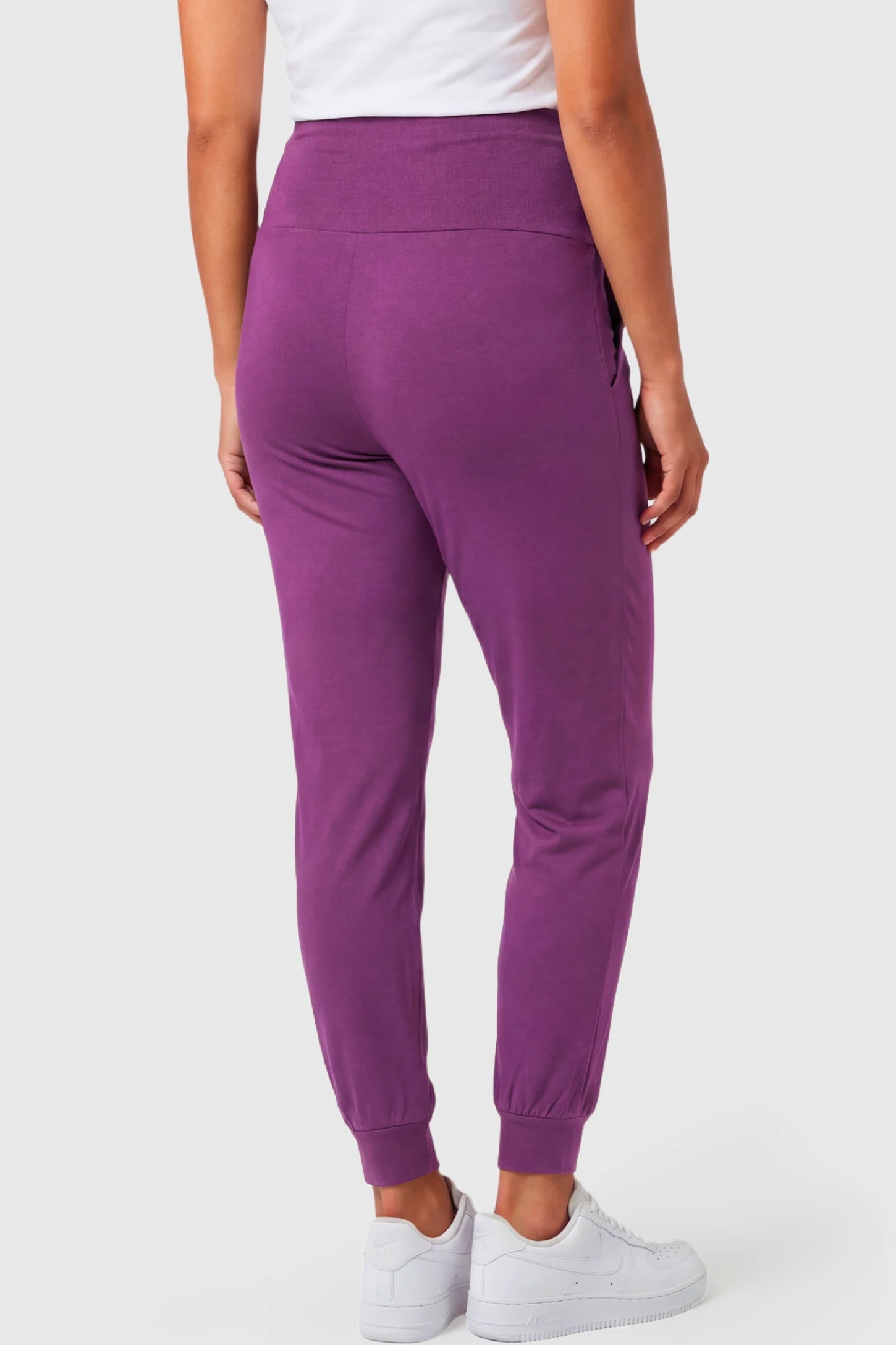 Full-Panel Cuffed Maternity Joggers Full-Panel Cuffed Maternity Joggers in purple featuring high-rise over-the-belly panel, and ribbed cuff hem on pregnant model.