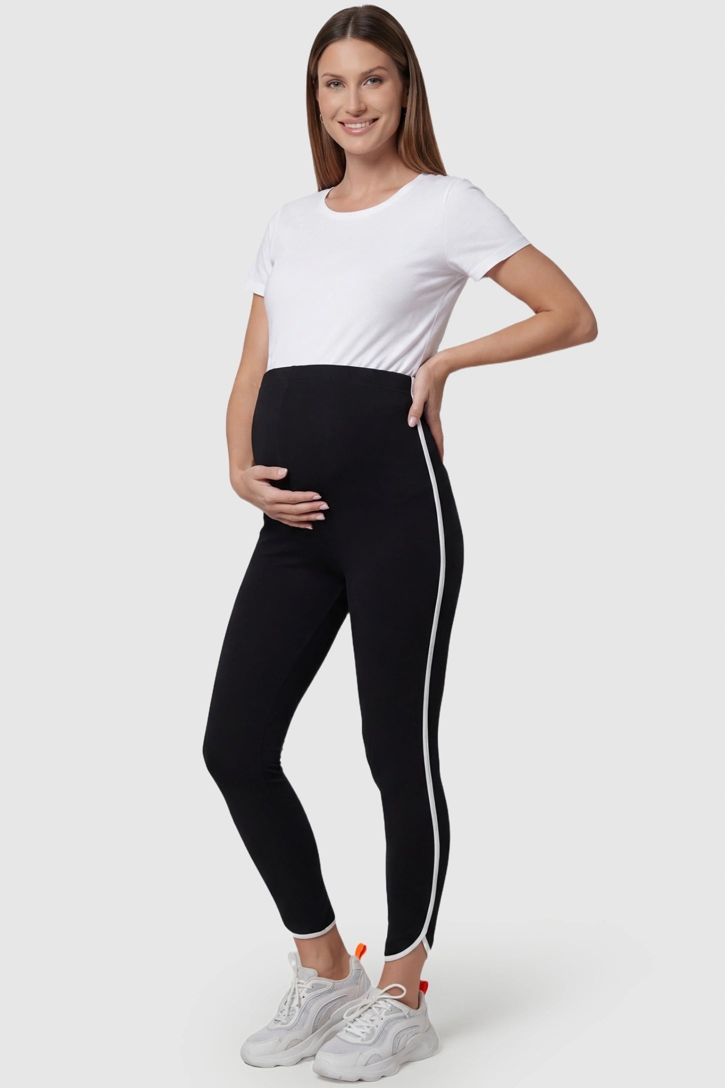 High Waisted Side Stripe Maternity Leggings in black featuring high-stretch recovery fabric on a pregnant model.