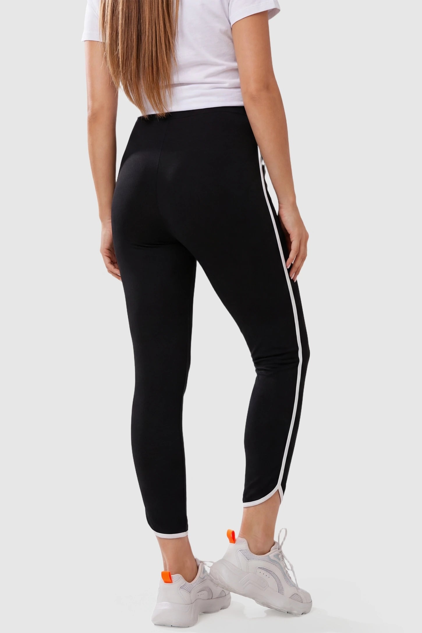 Shaping Side-Stripe Maternity Leggings High Waisted Side Stripe Maternity Leggings in black featuring a specialized butt-lifting design on a pregnant model from the back.