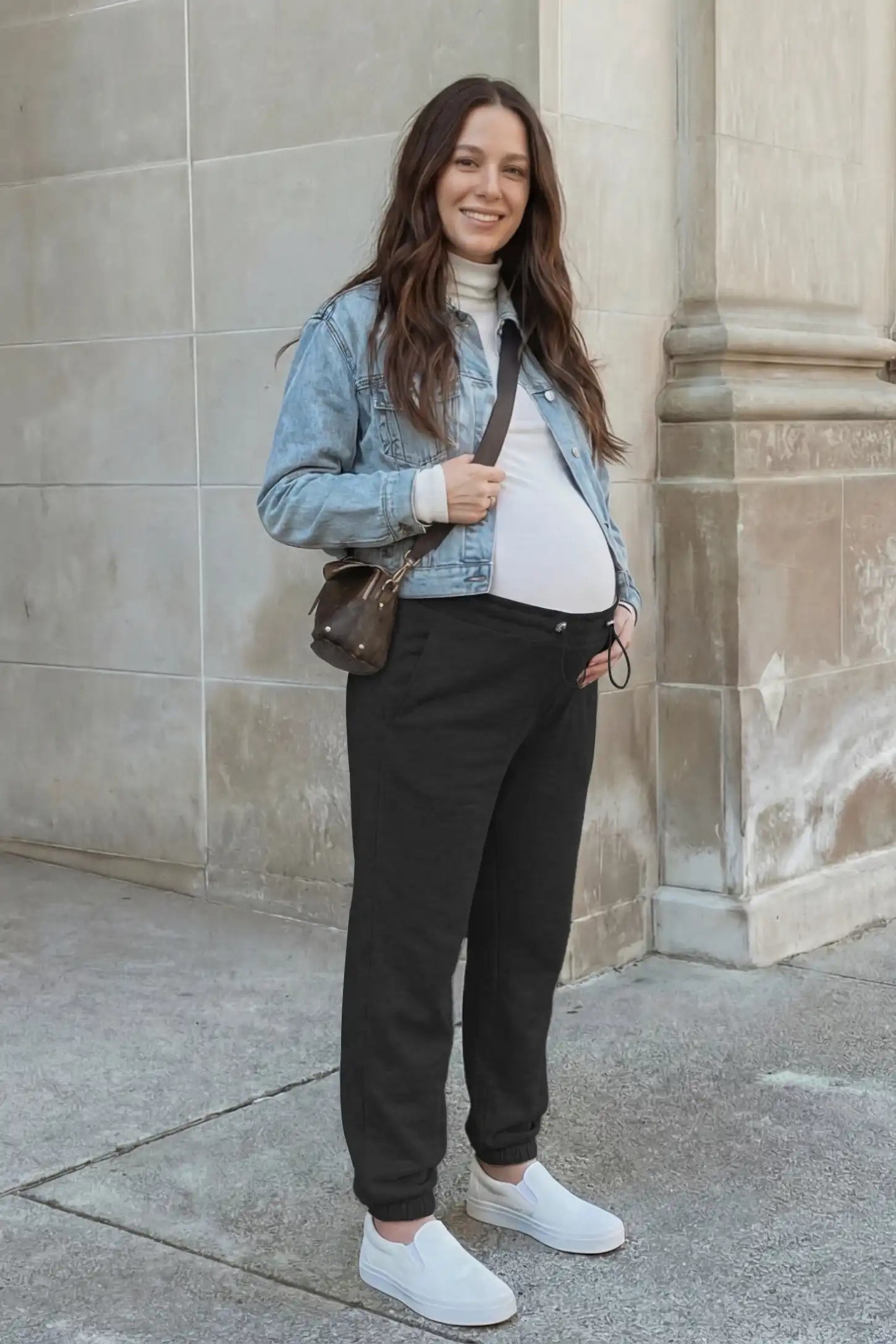 High-Rise Drawstring Waist Loose Fit Jogger Maternity Pants High-rise drawstring waist loose fit jogger maternity pants in black with relaxed fit, full body on editorial lifestyle model