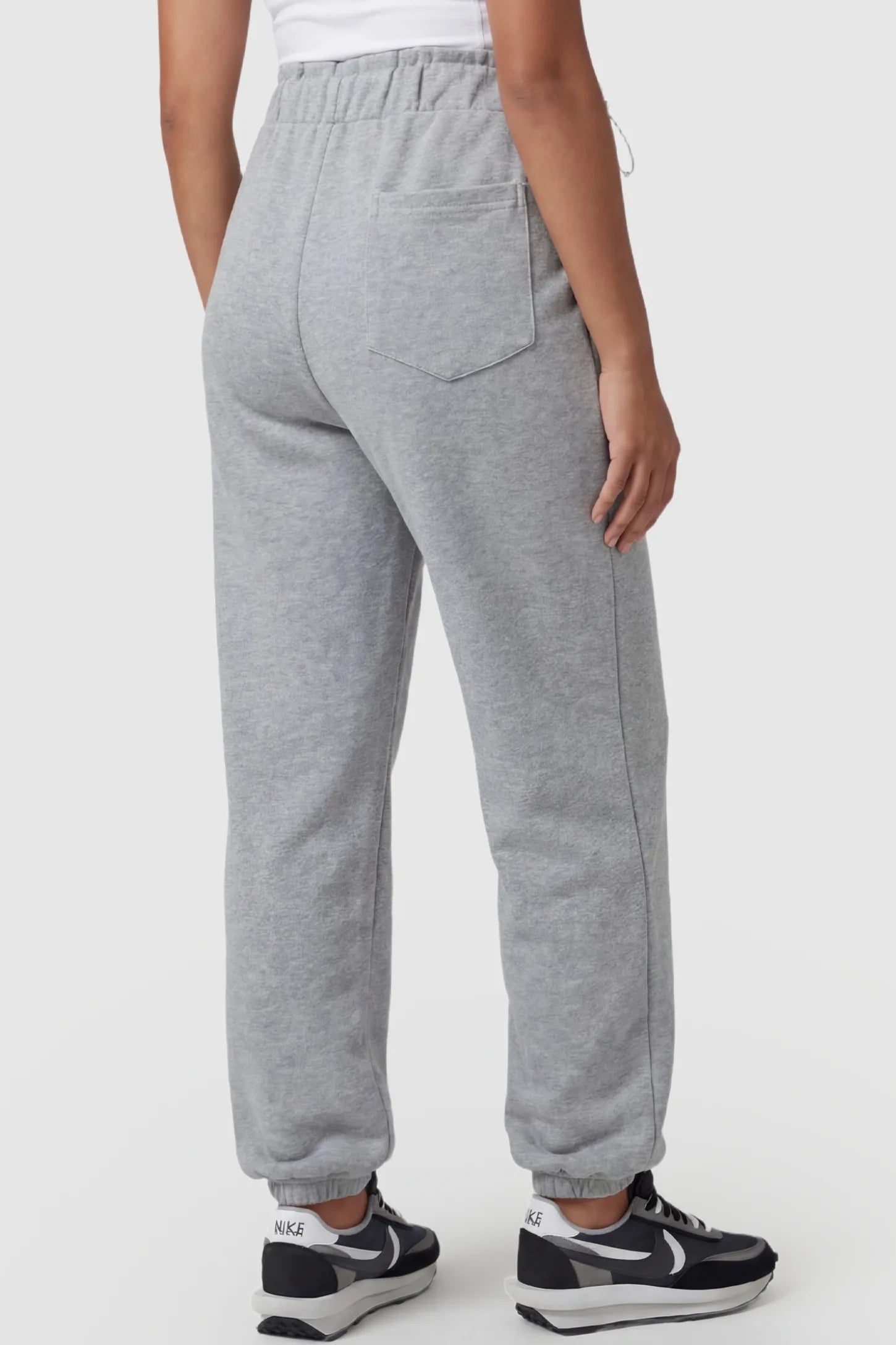 High-Rise Drawstring Waist Loose Fit Jogger Maternity Pants High-rise drawstring waist loose fit jogger maternity pants in gray with tapered jogger cuffs, back view on pregnant model