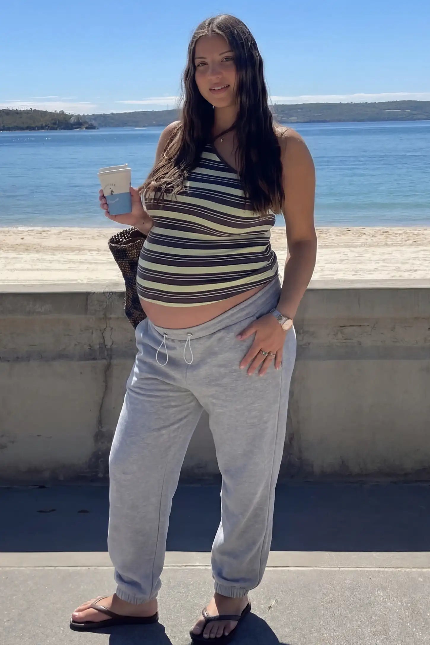 High-Rise Drawstring Waist Loose Fit Jogger Maternity Pants High-rise drawstring waist loose fit jogger maternity pants in gray with relaxed fit, full body on editorial lifestyle model