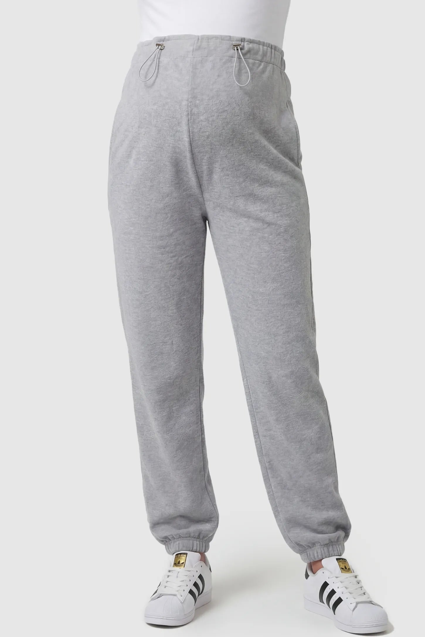 High-Rise Drawstring Waist Loose Fit Jogger Maternity Pants High-rise drawstring waist loose fit jogger maternity pants in gray with adjustable drawstring, front view on pregnant model