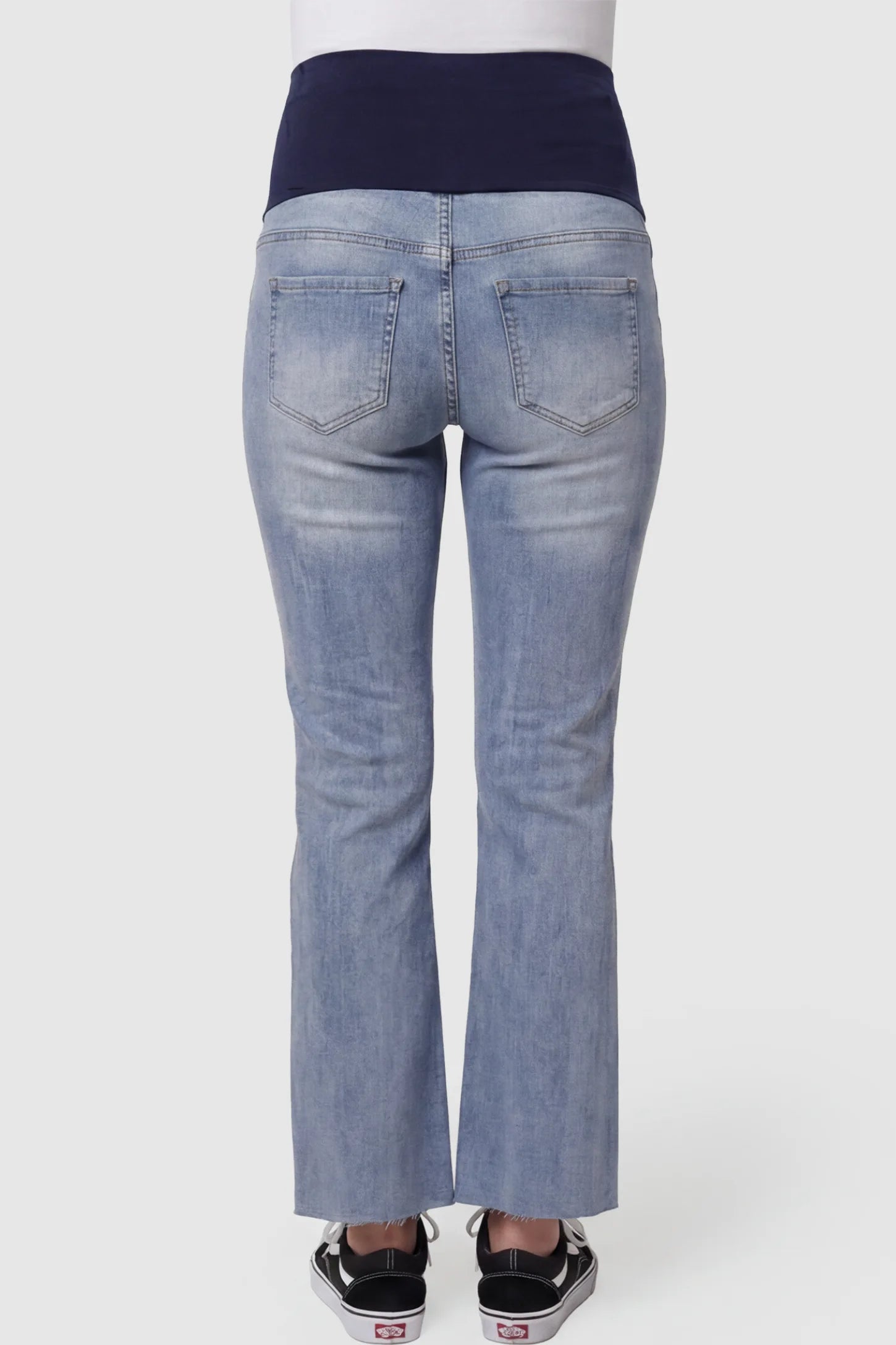 Knee Slit Wide Leg Maternity Jeans Knee slit wide leg maternity jeans in blue with back pockets, back view on pregnant model