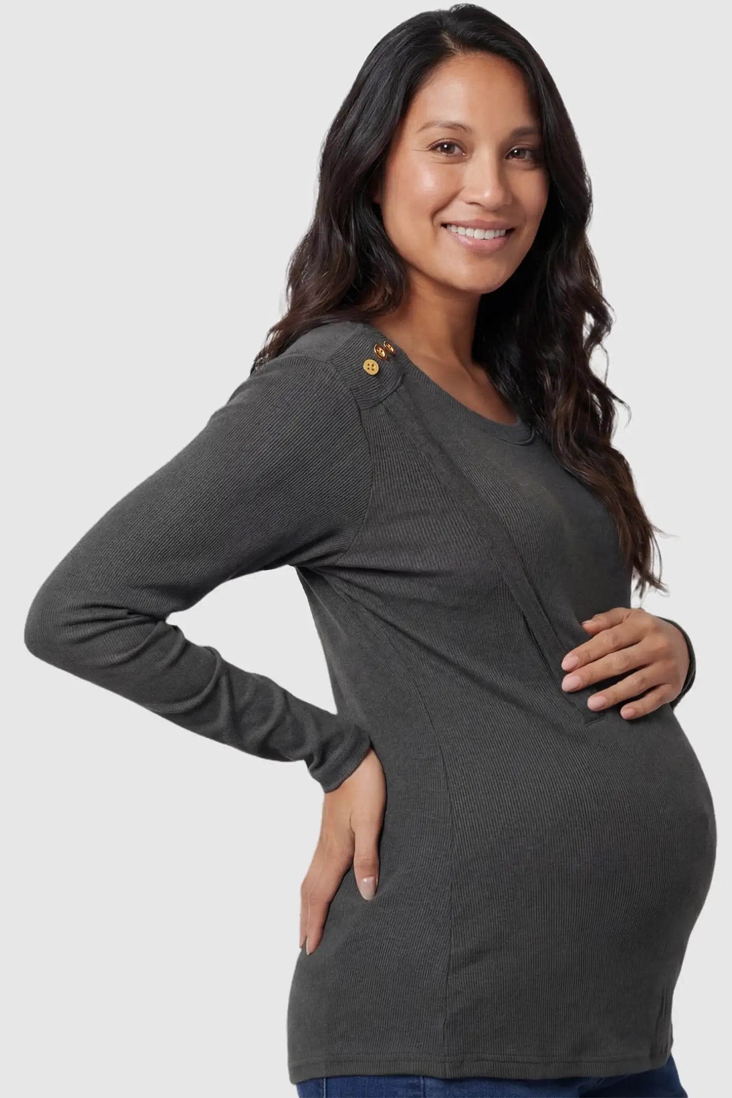 Dual-Side Nursing Access Ribbed Long Sleeve Maternity & Nursing Top Dual-Side Nursing Access Ribbed Long Sleeve Top in Dark Gray featuring button detail on a pregnant model in side view.
