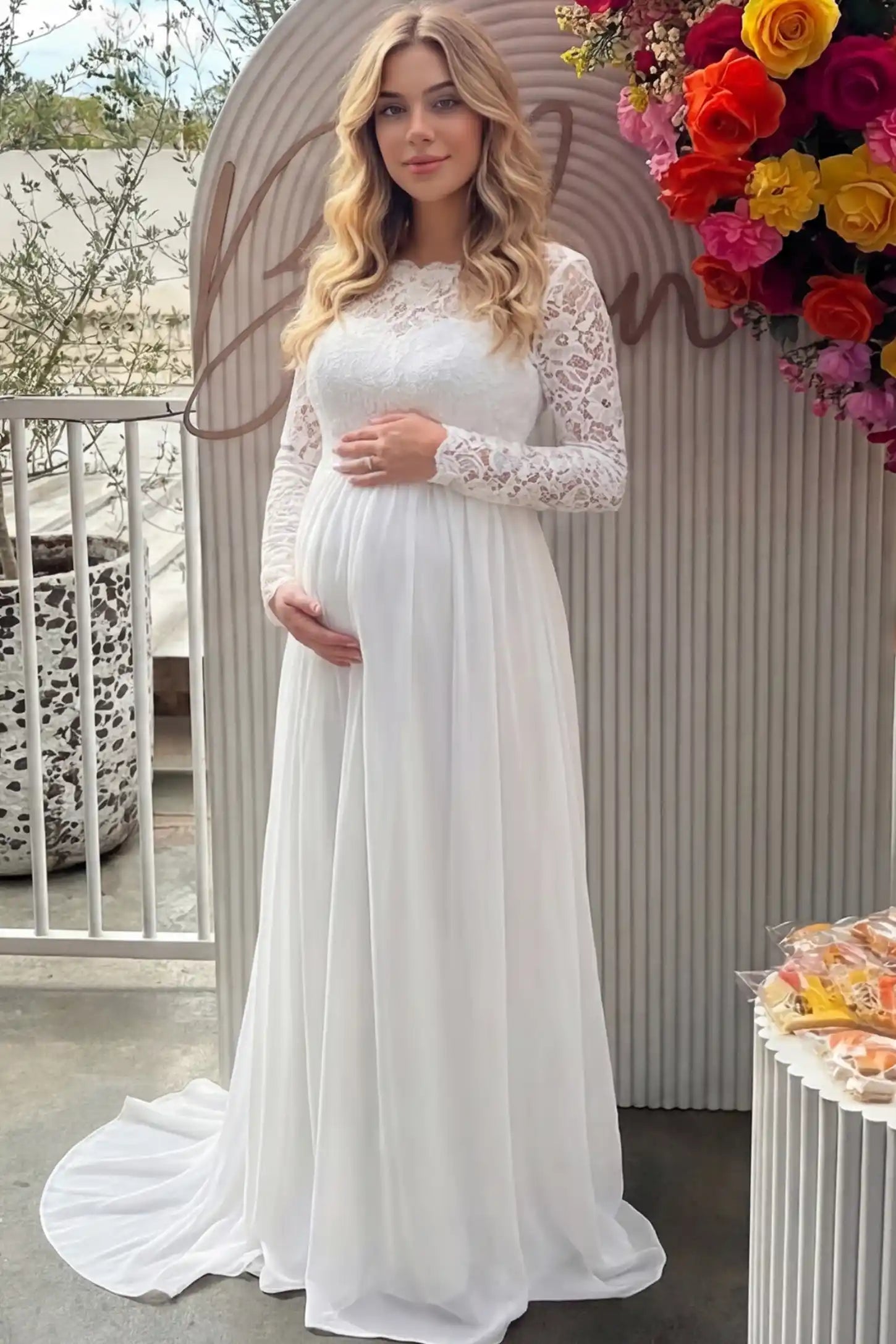 Long Sleeve Sweetheart Bridal Maternity Gown in white featuring illusion scoop neckline and floral lace sleeves on pregnant model.