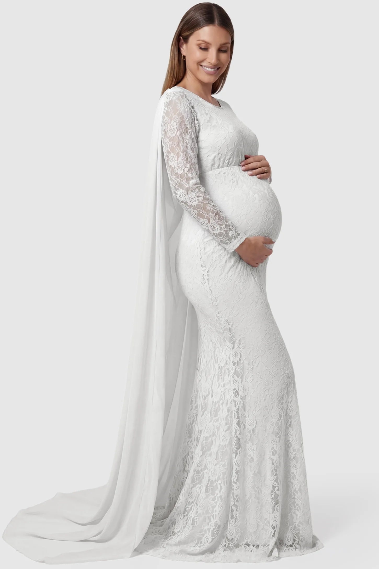 Lace & Chiffon Spliced Long Sleeve Maternity Photoshoot Gown Lace & Chiffon Spliced Maternity Photoshoot Gown in White featuring a slim fit lace skirt on a pregnant model side view.