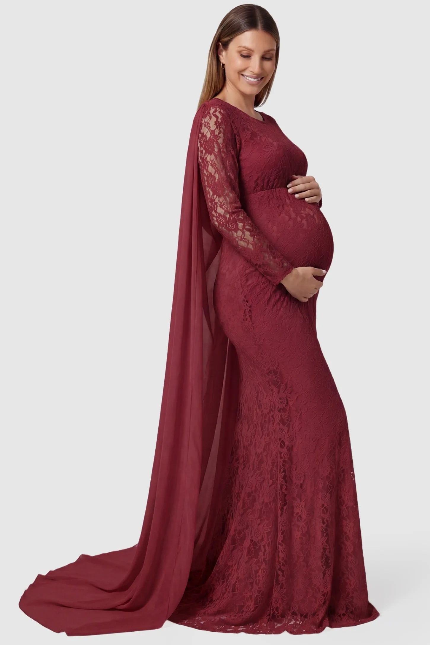 Lace & Chiffon Spliced Long Sleeve Maternity Photoshoot Gown Lace & Chiffon Spliced Maternity Photoshoot Gown in Wine Red featuring a sheer draped cape on a pregnant model side view.