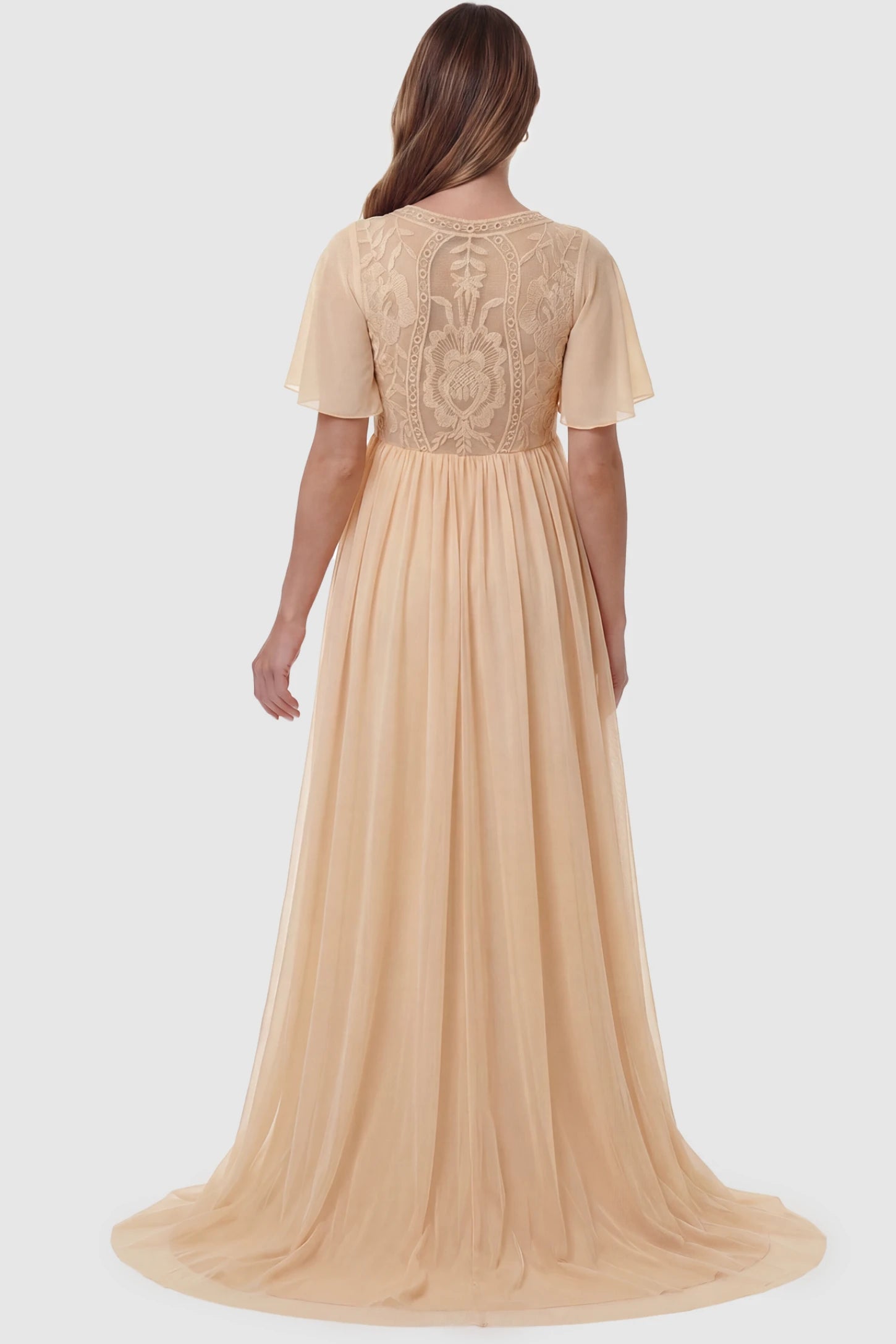 Lace Embroidered Short Flutter Sleeve Maxi Maternity Gown Lace embroidered short flutter sleeve maxi maternity gown in apricot featuring short flutter sleeve detail in back view on a pregnant model