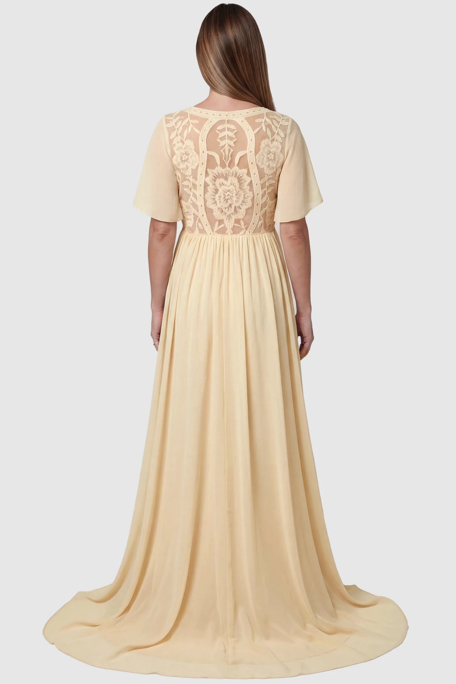 Lace Embroidered Short Flutter Sleeve Maternity Gown Lace embroidered short flutter sleeve maternity gown in apricot with delicate lace embroidery & flutter sleeves, back view on pregnant model