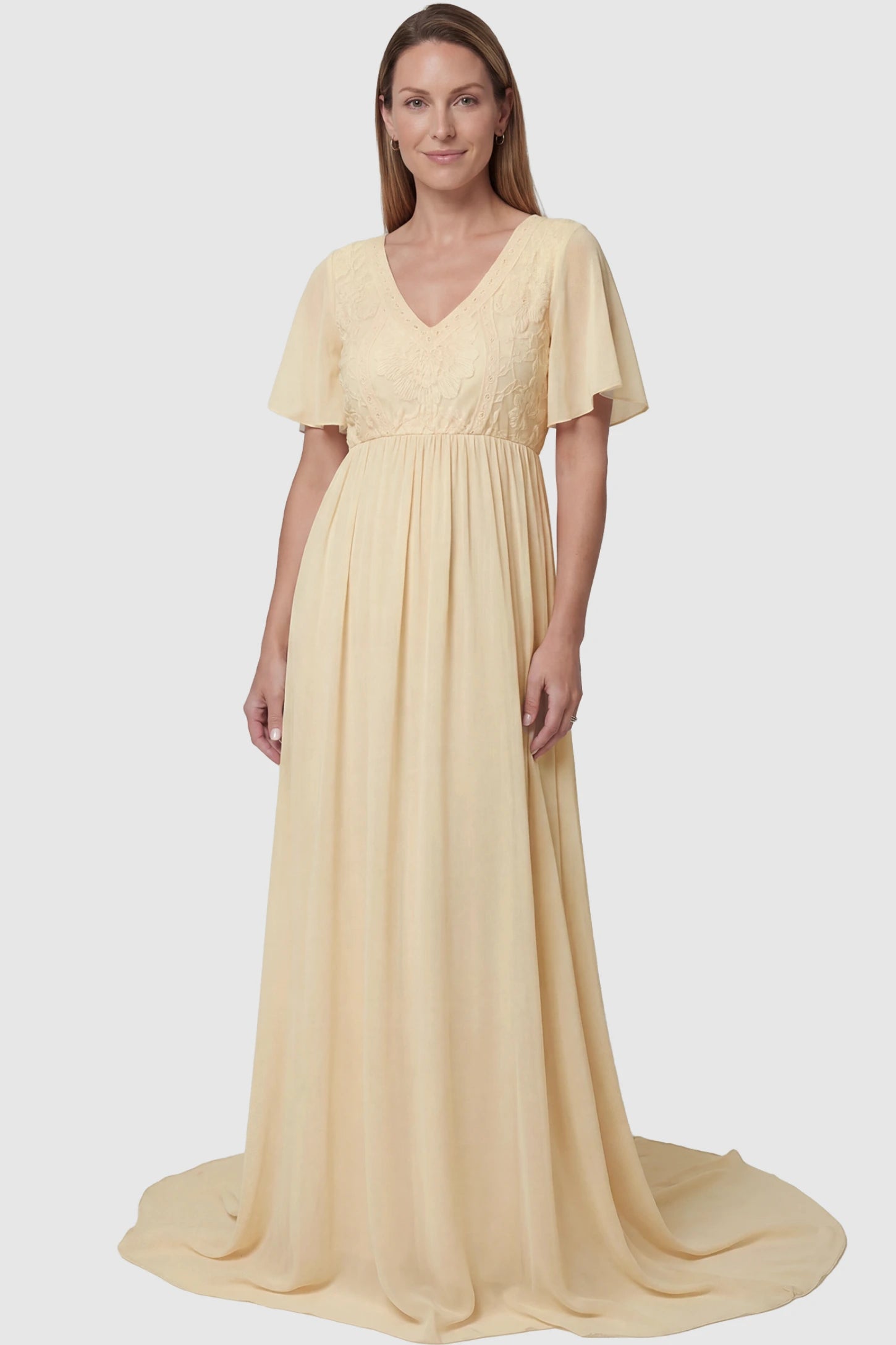 Lace Embroidered Short Flutter Sleeve Maternity Gown Lace embroidered short flutter sleeve maternity gown in apricot with delicate lace embroidery & flutter sleeves, front view on postpartum model