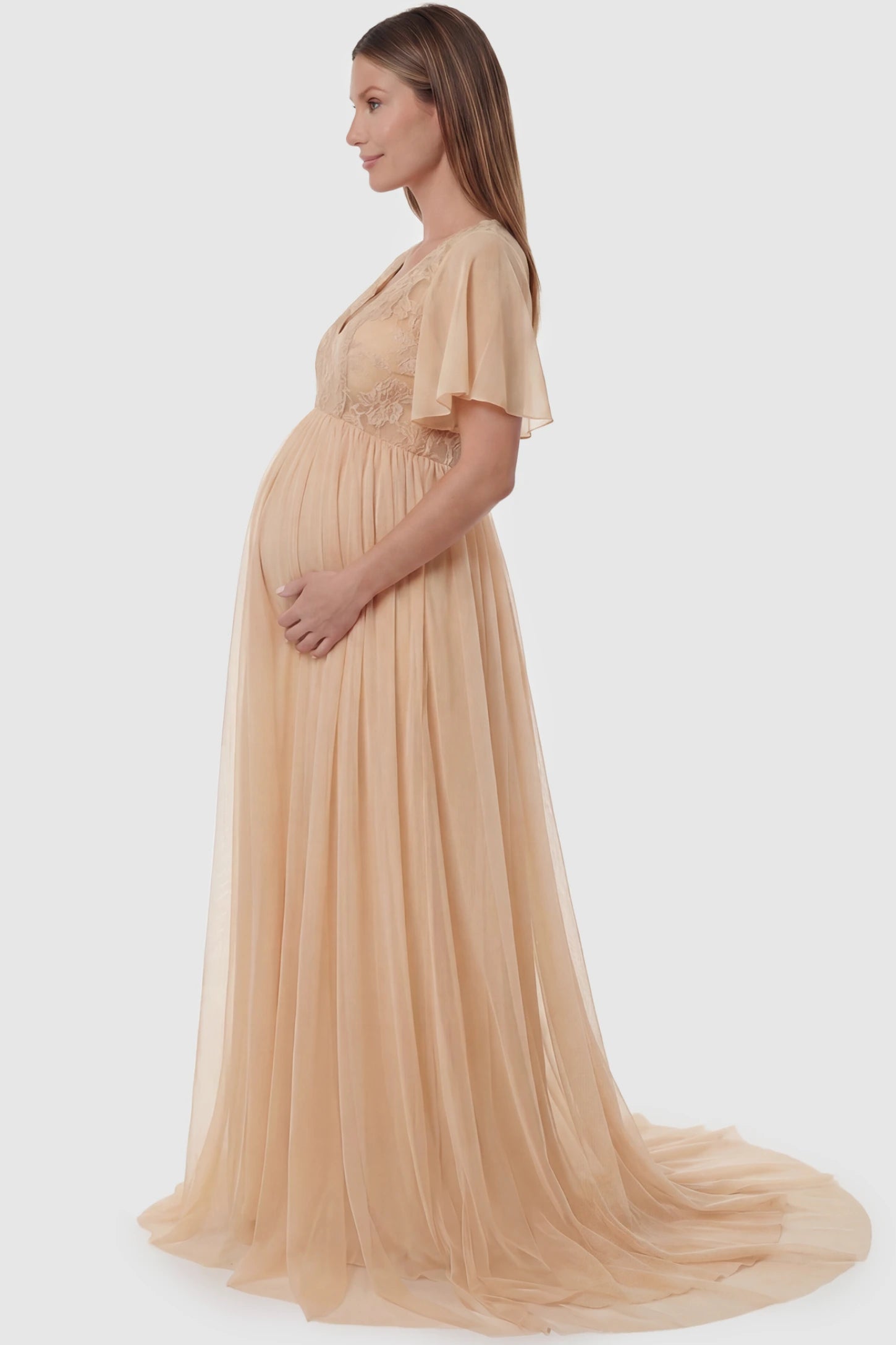 Lace embroidered short flutter sleeve maxi maternity gown in apricot featuring graceful long-train design in side view on a pregnant model