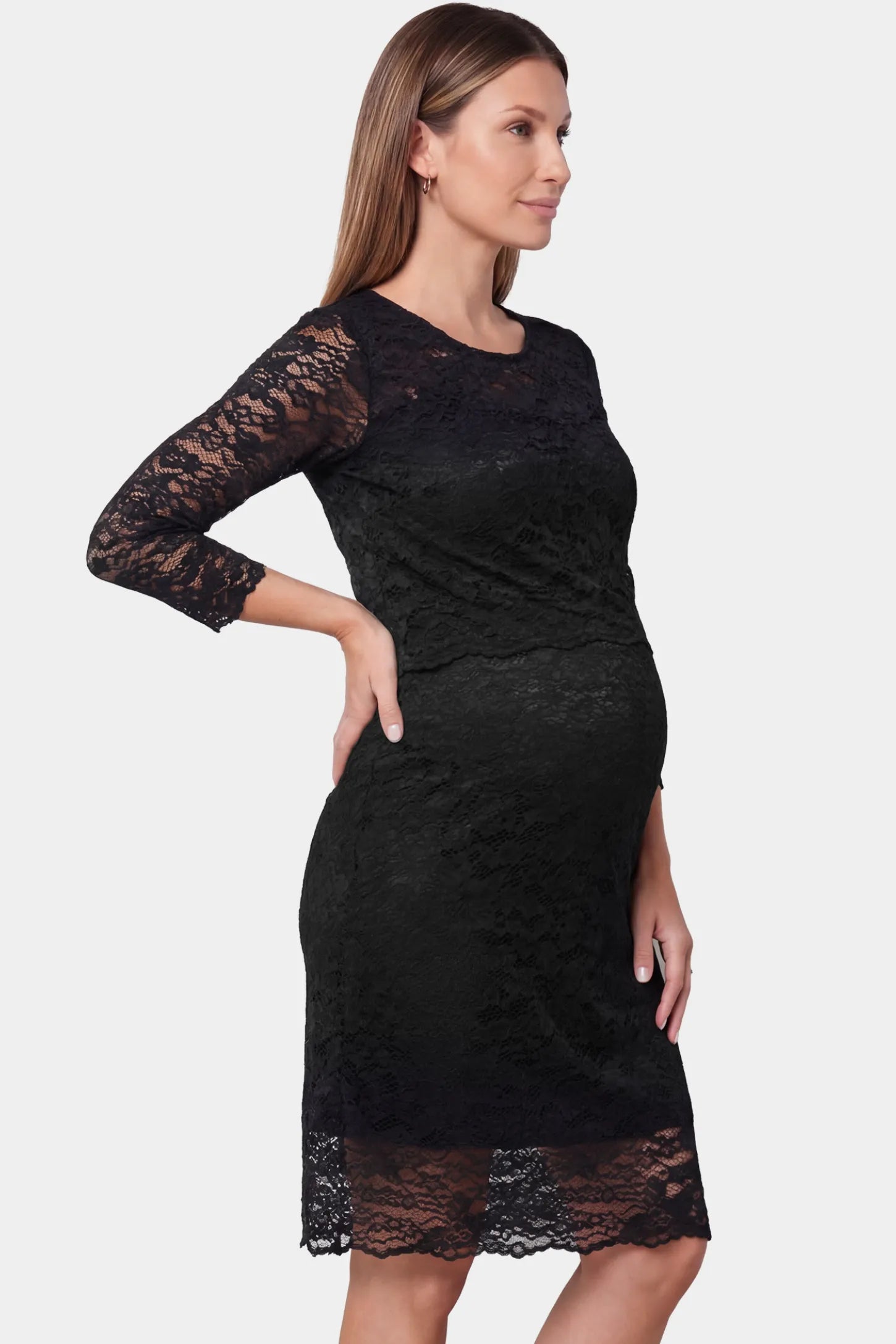 Lace Mid-Length Sleeve Midi Maternity & Nursing Dress Lace mid-length sleeve midi maternity and nursing dress in black featuring mid-length lace sleeve in side view on a pregnant model