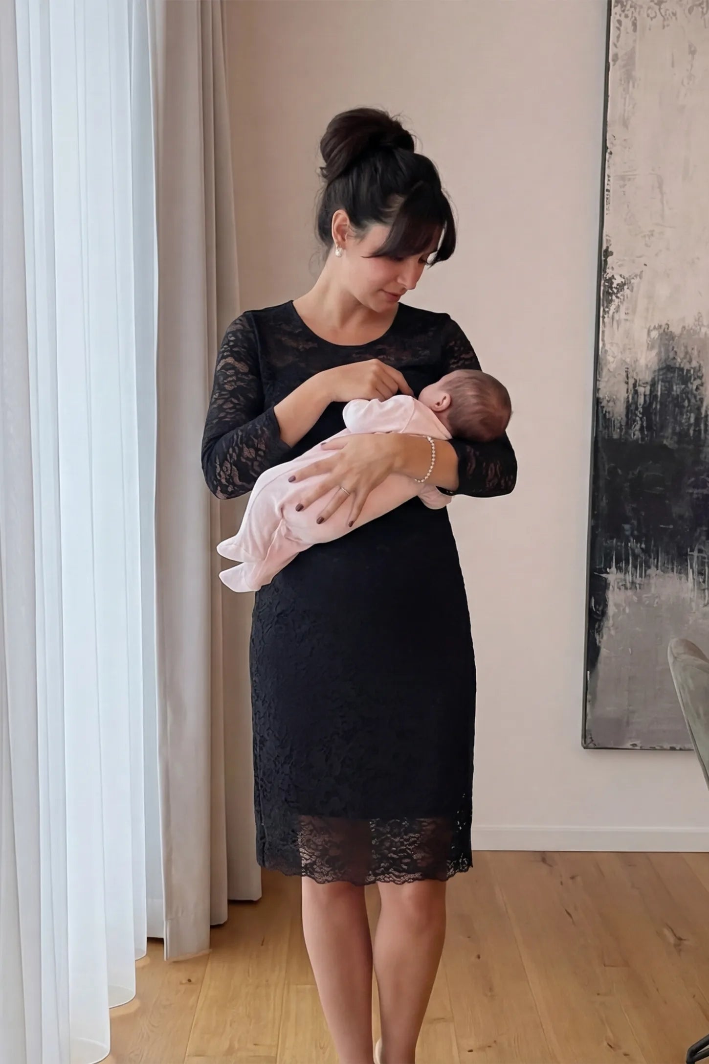 Lace Mid-Length Sleeve Midi Maternity & Nursing Dress Lace mid-length sleeve midi maternity and nursing dress in black featuring concealed nursing opening in front view on a UGC model