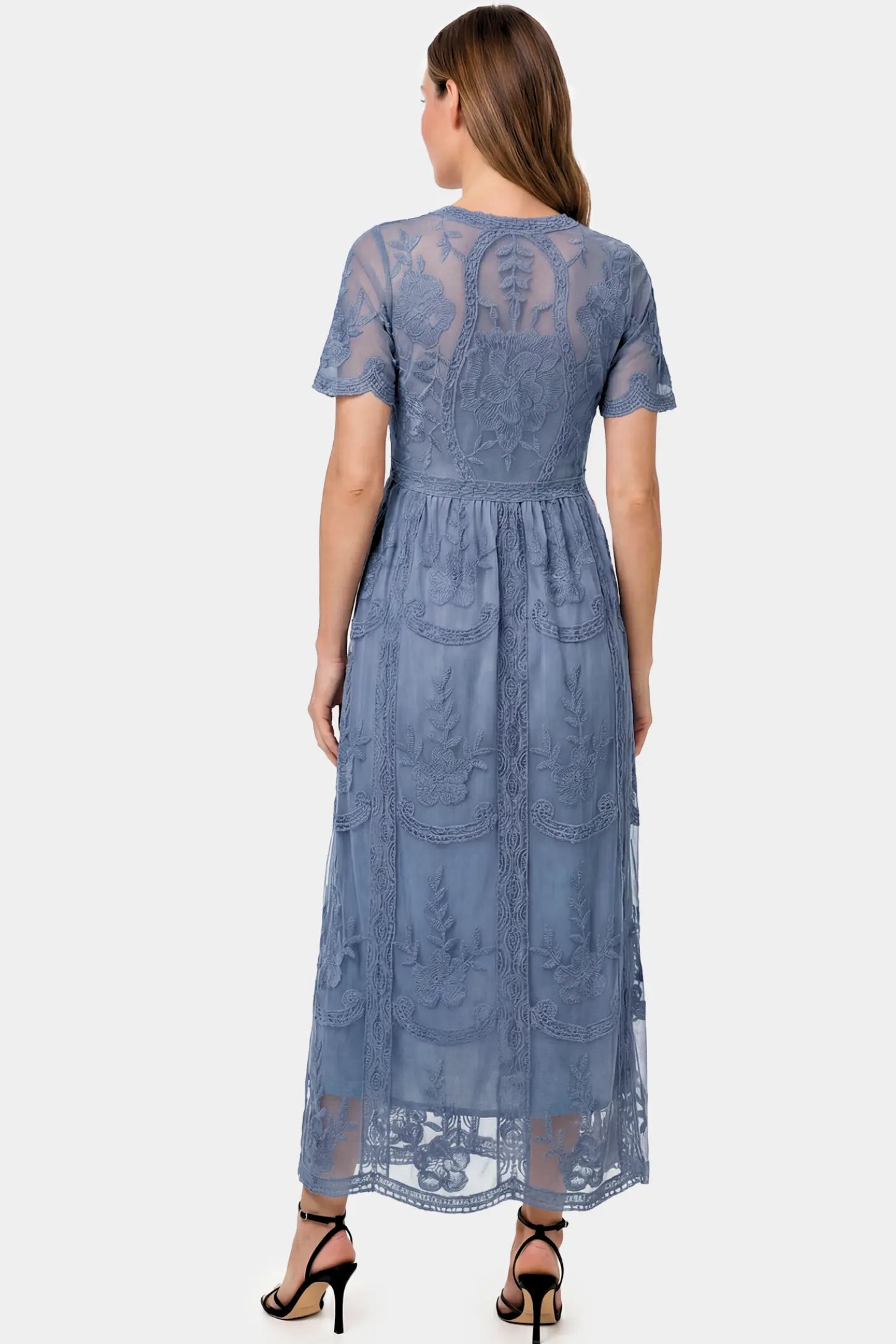 Lace Short Sheer Sleeve Maternity Maxi Dress Lace Short Sheer Sleeve Maternity Maxi Dress in blue lace featuring sheer short sleeves and an empire waist silhouette on a pregnant model.