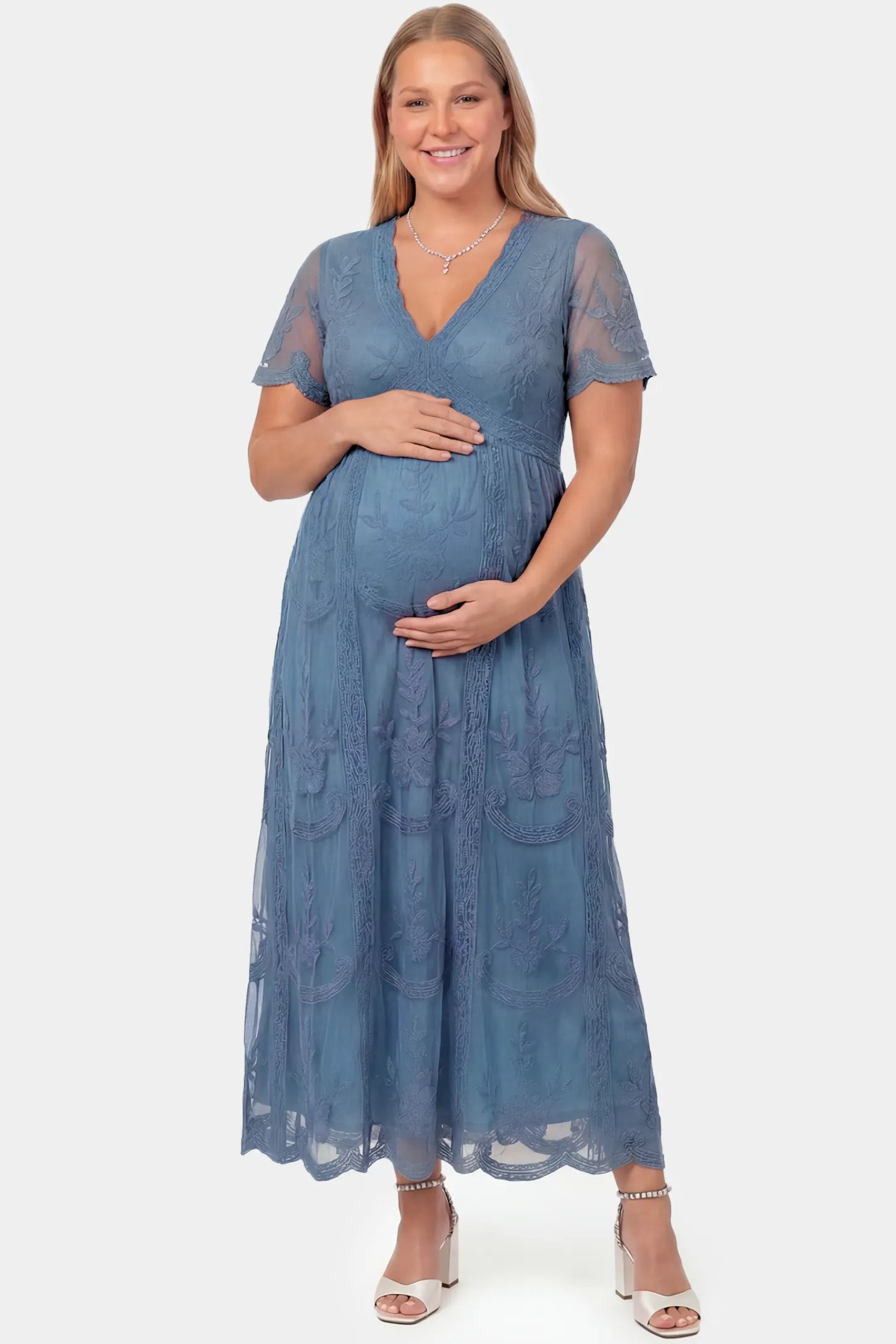 Lace Short Sheer Sleeve Maternity Maxi Dress Lace Short Sheer Sleeve Maternity Maxi Dress in blue lace featuring sheer short sleeves and an empire waist silhouette on a plus size pregnant model.