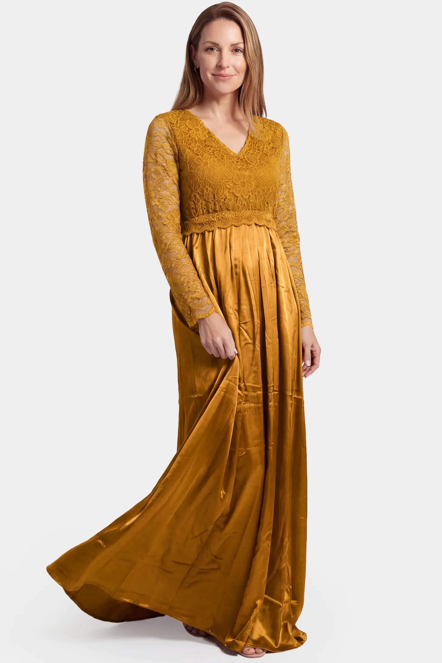 Lace-Spliced Silk Long Sleeve Maxi Maternity Dress Lace-spliced silk long sleeve maxi maternity dress in gold featuring trailing skirt in full body front view on a postpartum model
