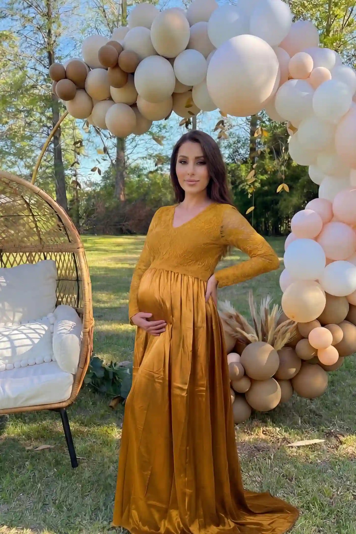 Lace-Spliced Silk Long Sleeve Maxi Maternity Dress Lace-spliced silk long sleeve maxi maternity dress in gold featuring lace bodice and sleeves in front view on a UGC model