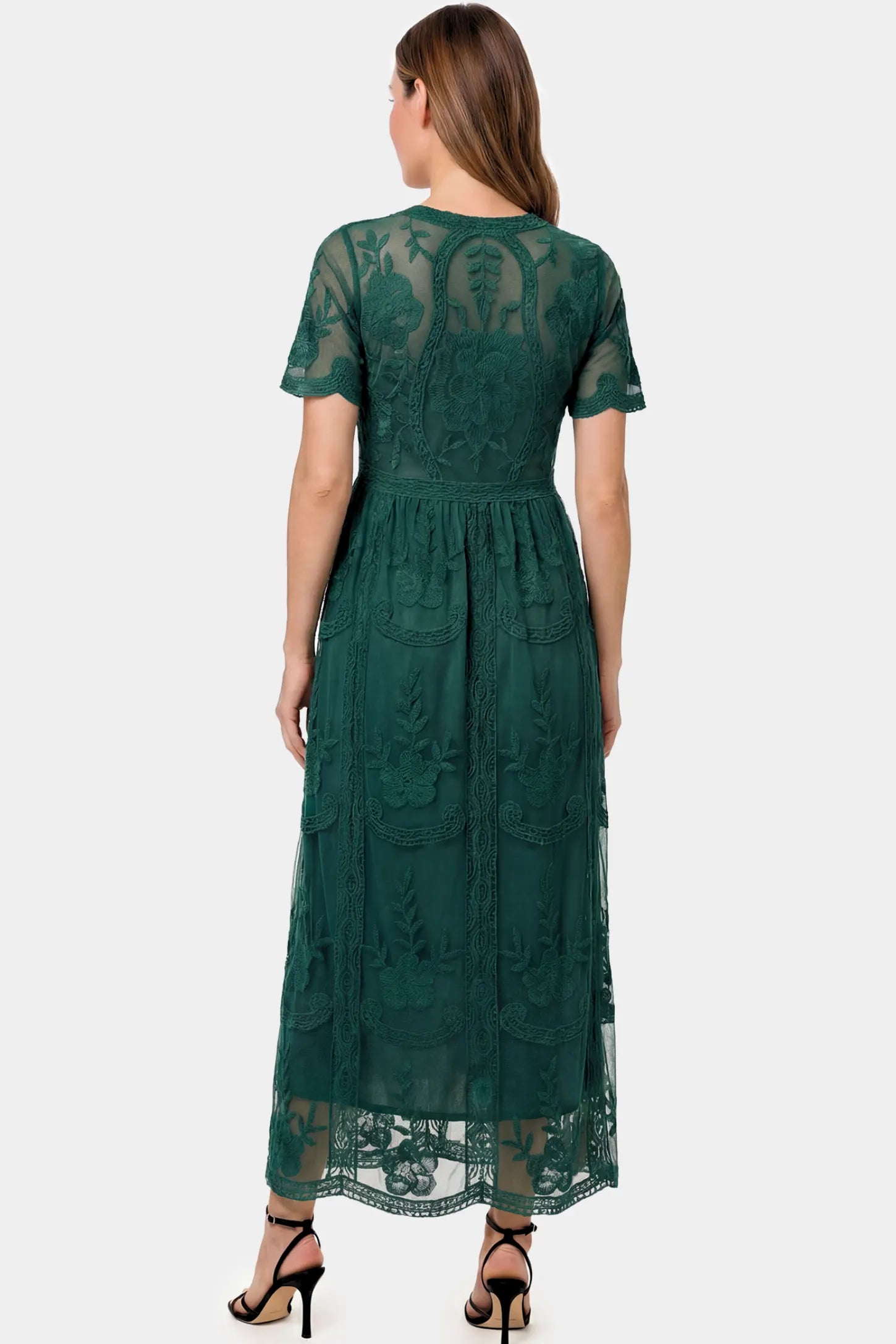 Lace Short Sheer Sleeve Maternity Maxi Dress Lace Short Sheer Sleeve Maternity Maxi Dress in green lace featuring sheer short sleeves and an empire waist silhouette on a pregnant model.