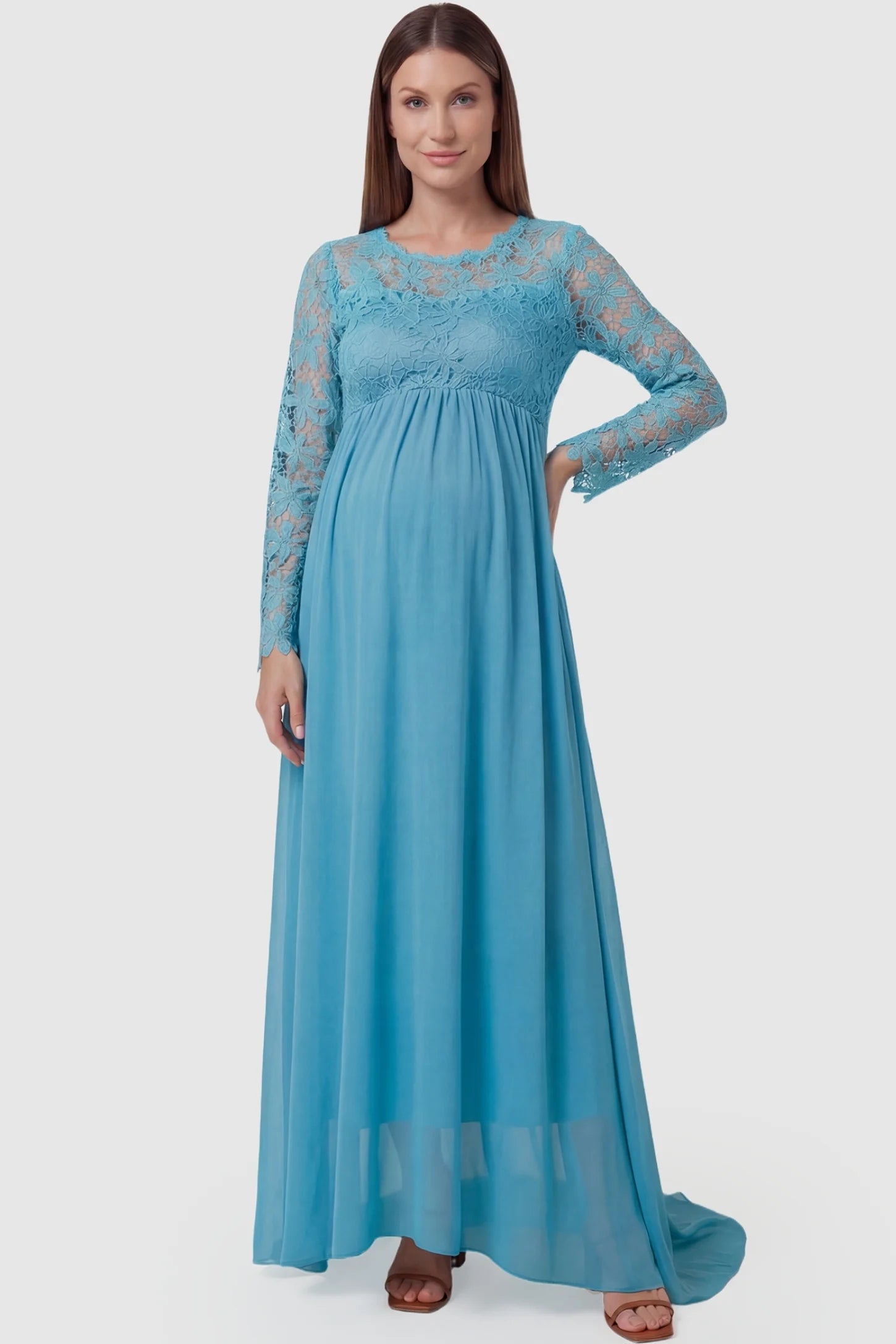 Lace Long Sleeve Full Skirt Maxi Maternity Dress Lace long sleeve full skirt maxi maternity dress in light blue featuring empire waist in full body front view on a pregnant model