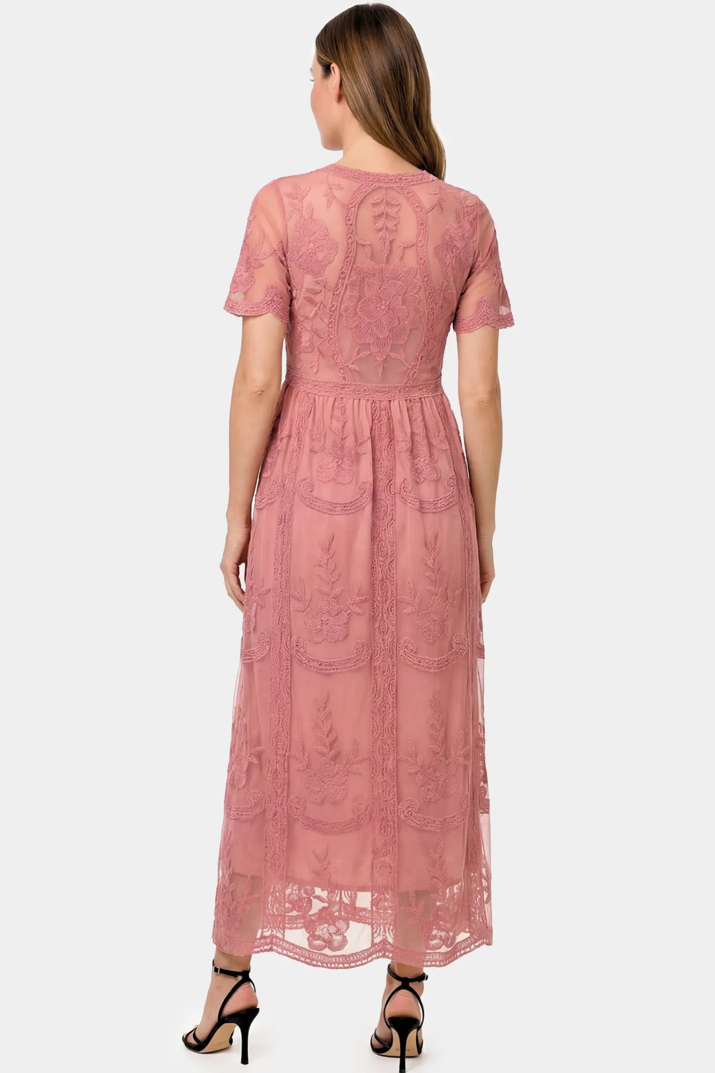 Lace Short Sheer Sleeve Maternity Maxi Dress Lace Short Sheer Sleeve Maternity Maxi Dress in pink lace featuring sheer short sleeves and an empire waist silhouette on a pregnant model.