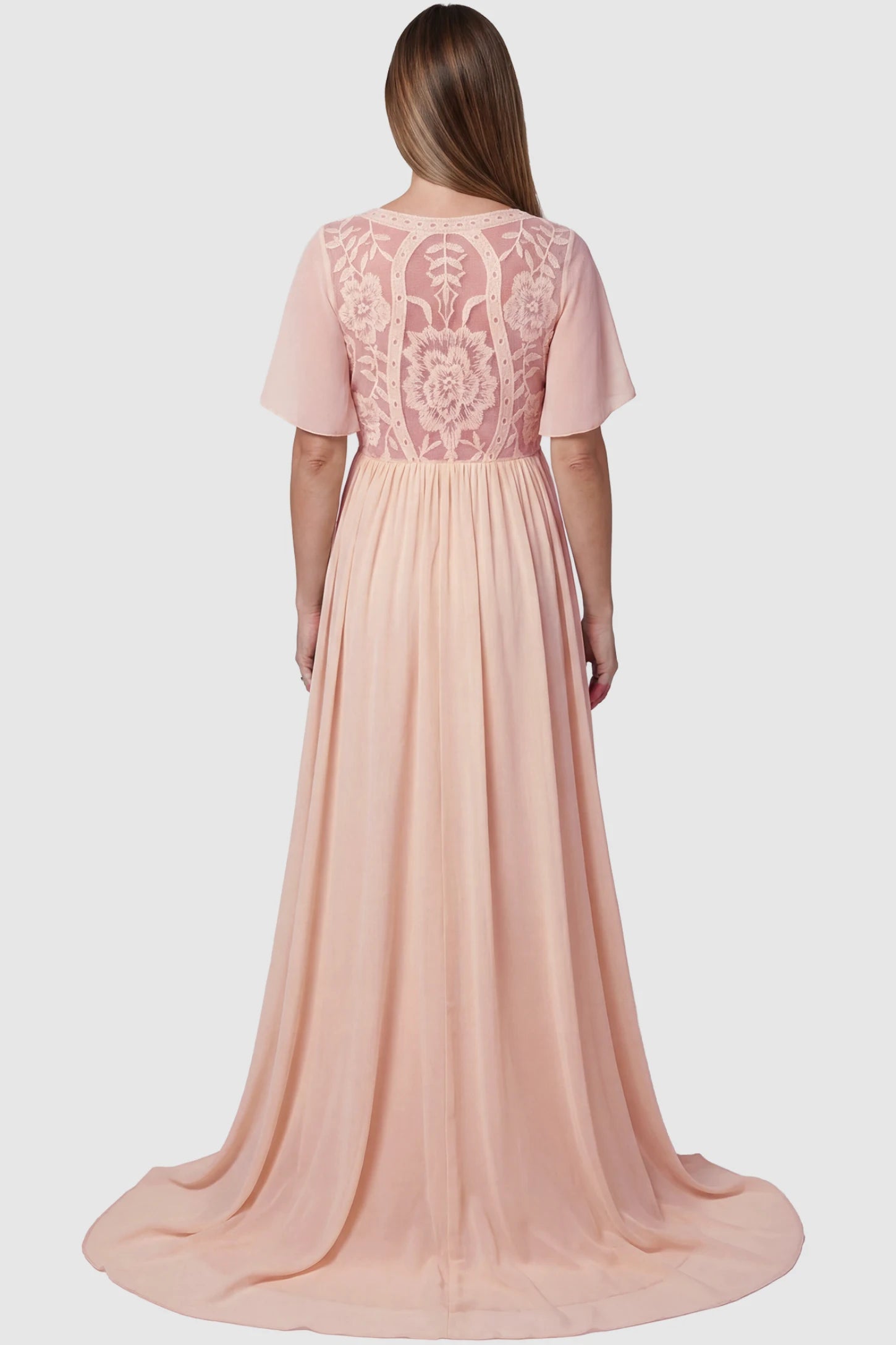 Lace Embroidered Short Flutter Sleeve Maternity Gown Lace embroidered short flutter sleeve maternity gown in pink with delicate lace embroidery & flutter sleeves, back view on pregnant model