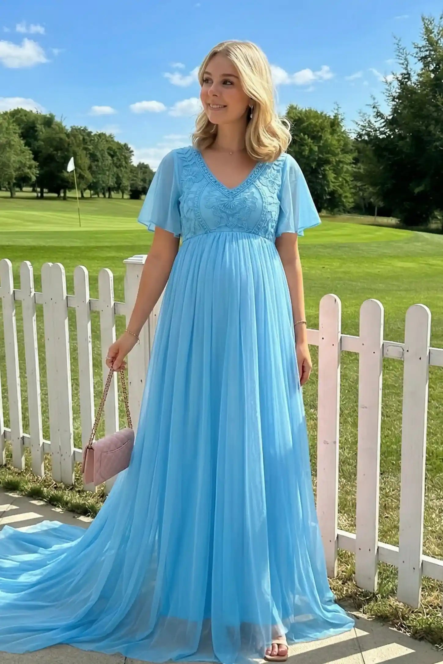 Lace Embroidered Short Flutter Sleeve Maxi Maternity Gown Lace embroidered short flutter sleeve maxi maternity gown in sky blue with embroidered lace and long-train, editorial lifestyle model
